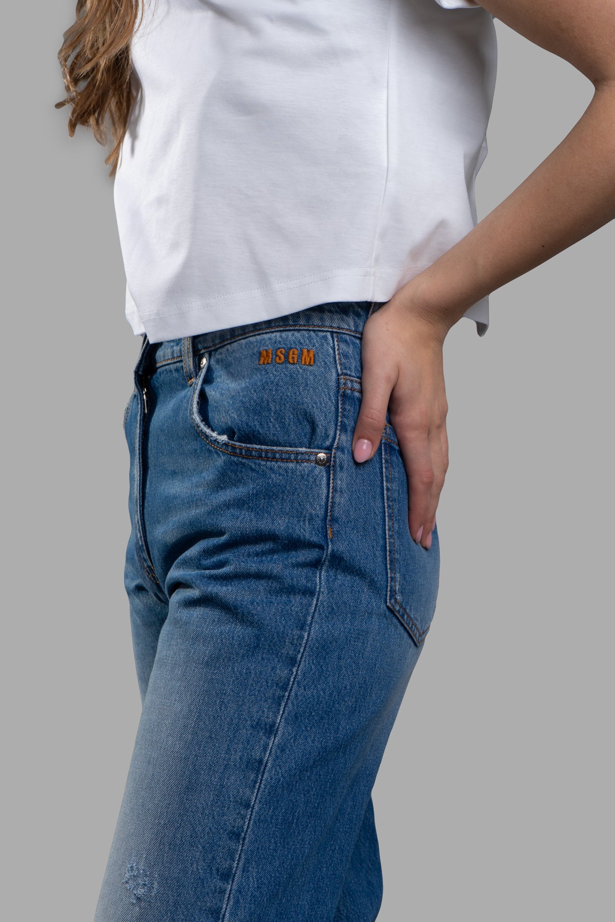 **MSGM Cropped Wide-leg Jeans in blue, featuring high waist, five pockets, and flattering silhouette on-model.**