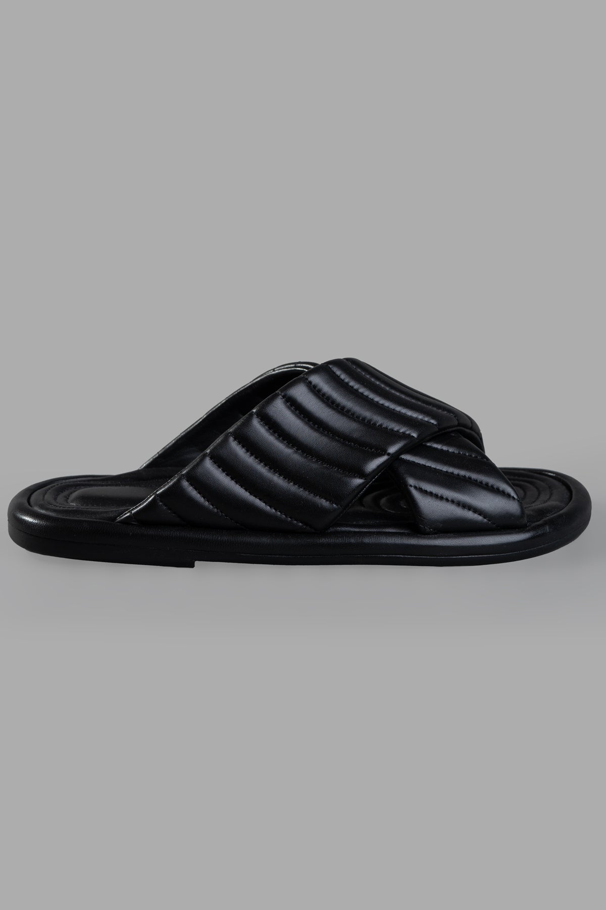 Mattia Capezzani Black Slides side view: elegant criss-cross straps, textured design, and cushioned footbed in image #1.