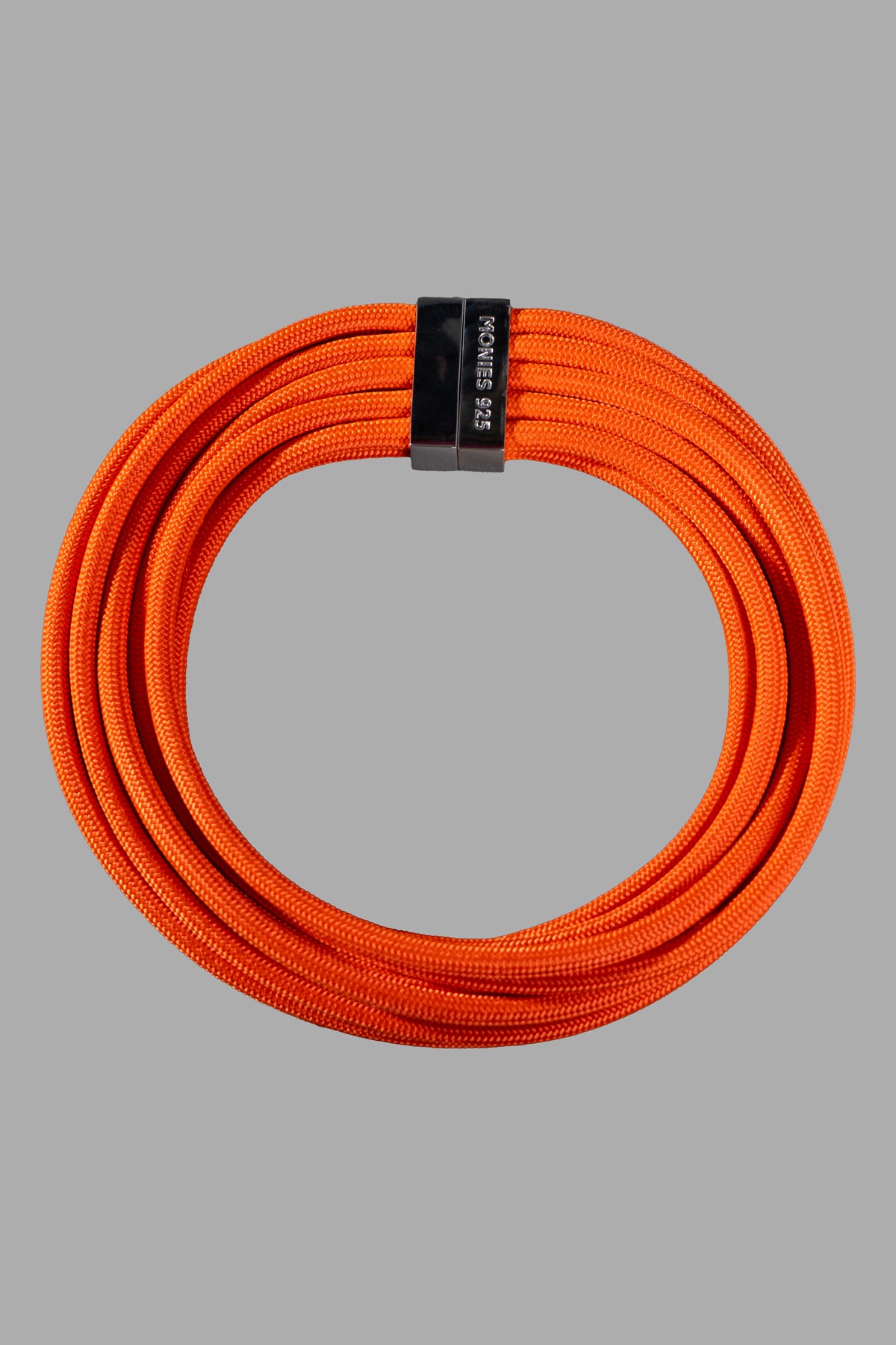 Monies Orange Infini Necklace close-up showing magnetic lock and sterling silver detail on vibrant orange cord.