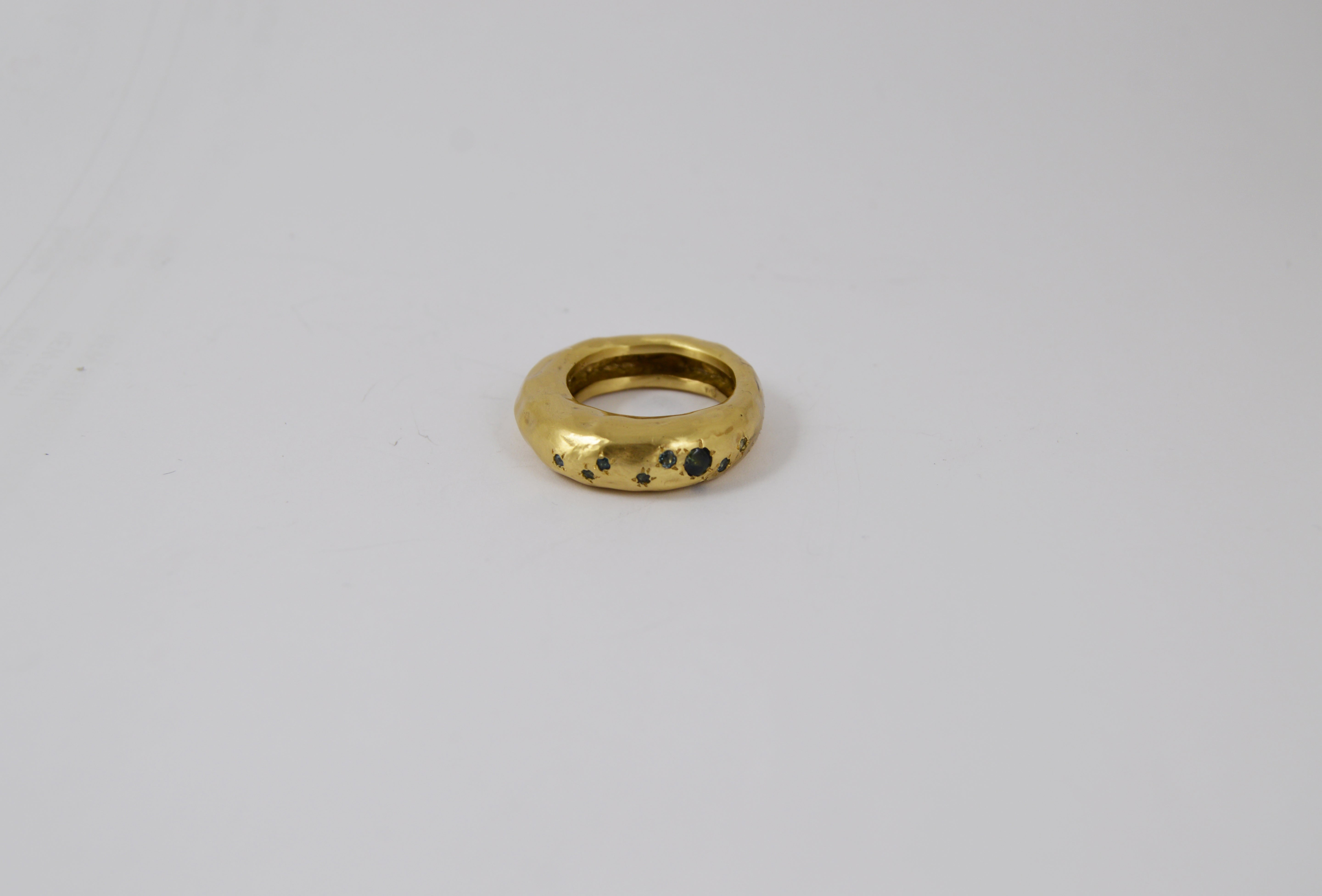 Rosa Maria Firat Ring, copper with organic shape and blue sapphires, front view detail.