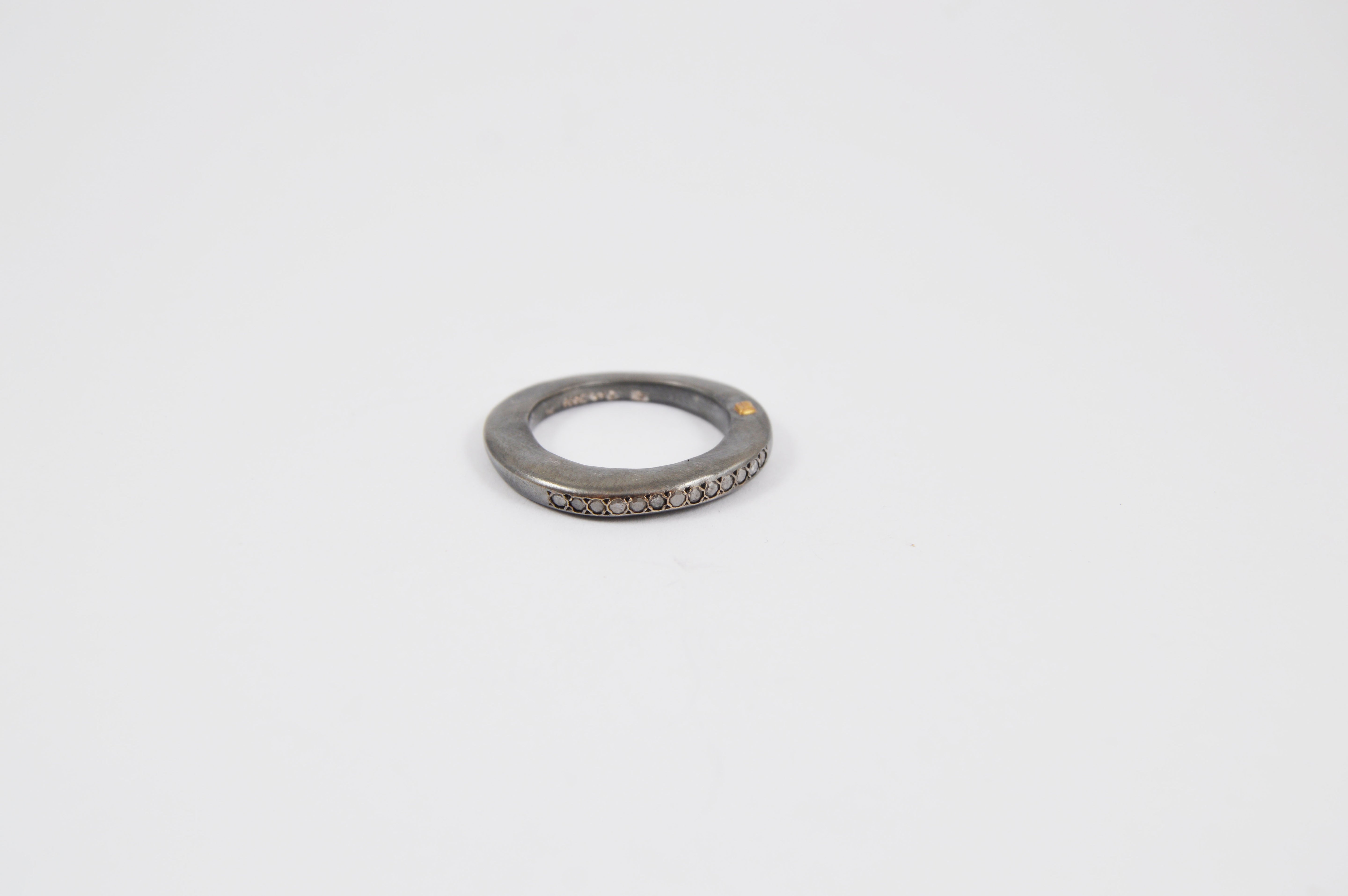 Rosa Maria Hayet Ring features a unique, handcrafted silver design with a row of cut diamonds, showcasing its organic.