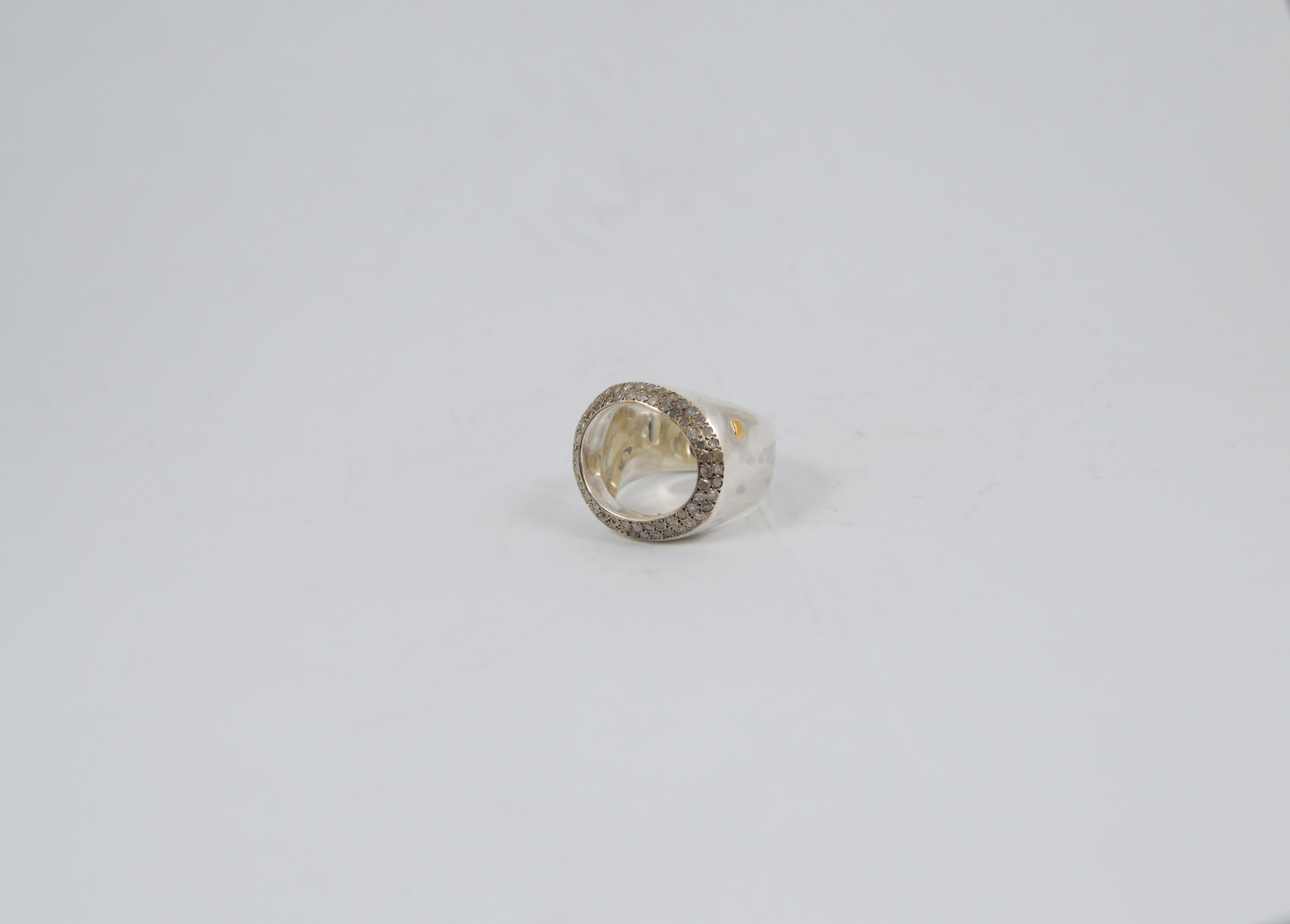 Rosa Maria Heyonn Ring in silver with cut diamonds, featuring a unique organic shape, displayed on a clean white background.