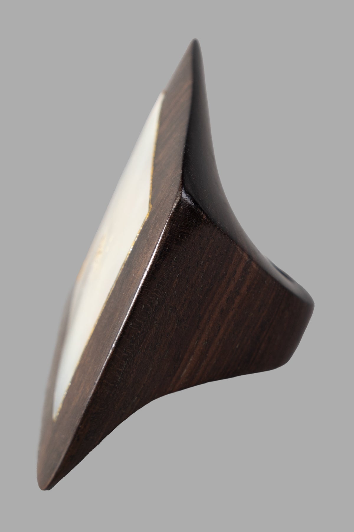 Monies Geometric Ring in ebony wood with bold modern design, showcasing unique angles and textures from a side view.