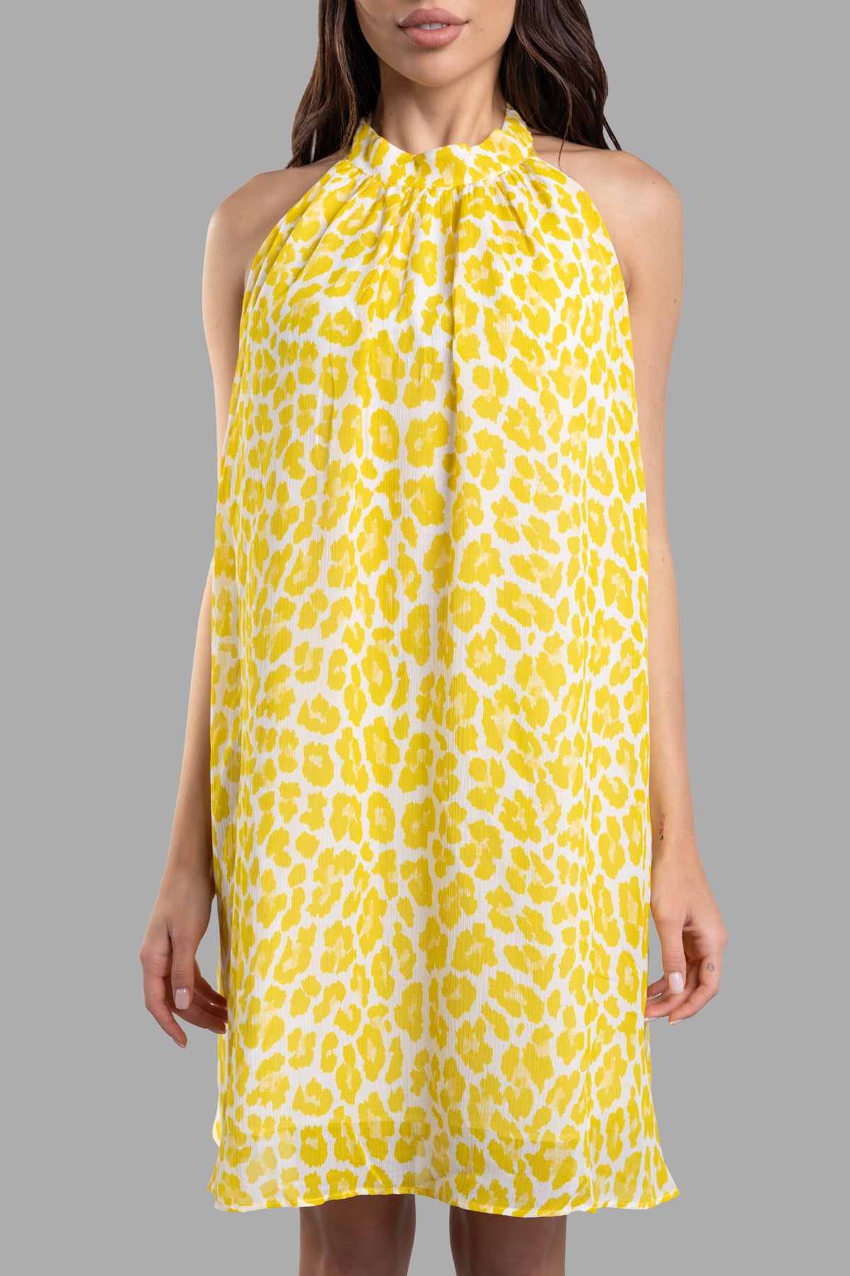 Fisico Leopard-print Beach Dress with halterneck design, featuring a vibrant yellow and white pattern, shown on model.