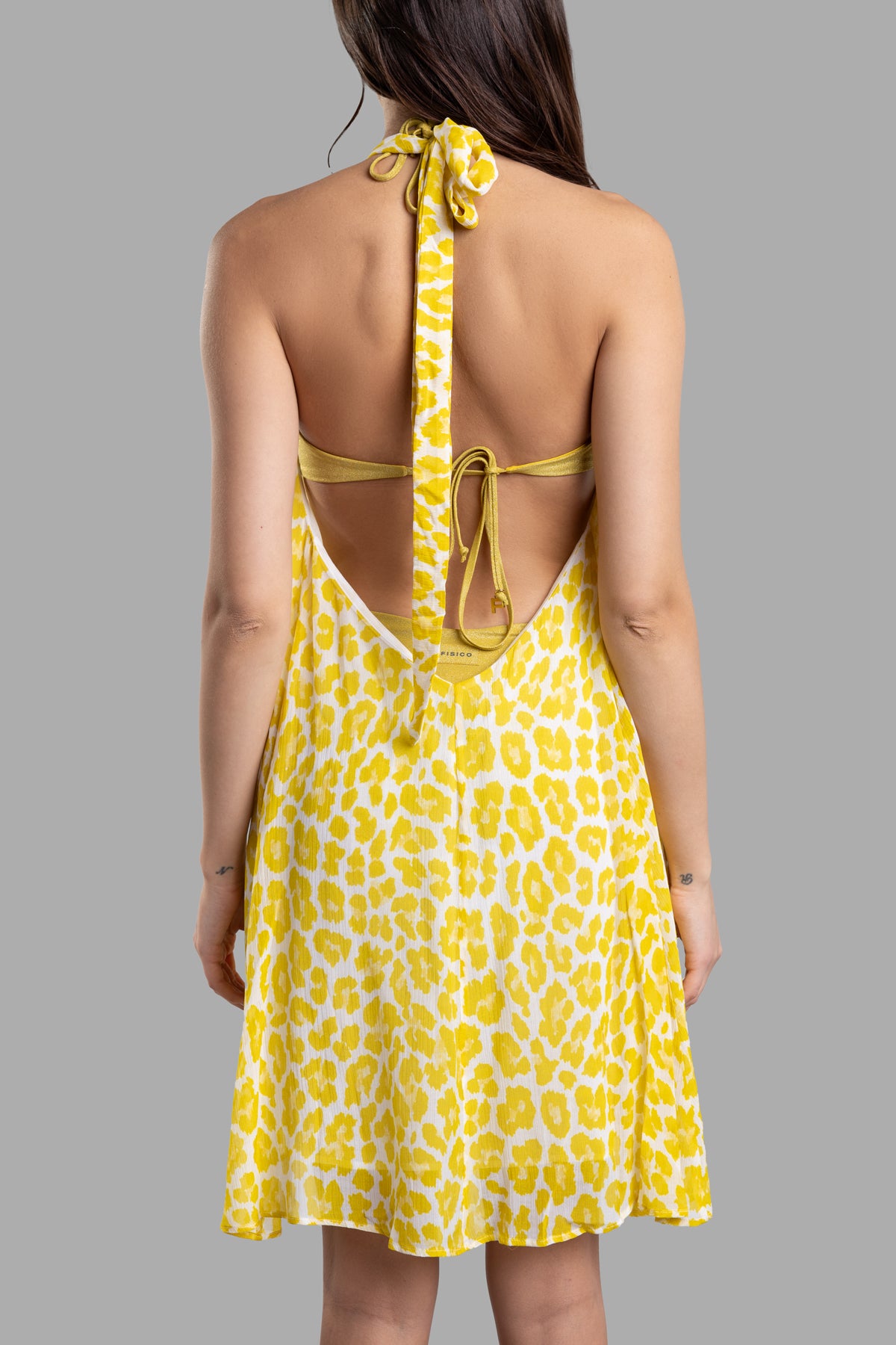 Fisico Leopard-print Beach Dress featuring a halterneck, open back, and vibrant yellow print, shown from the back.