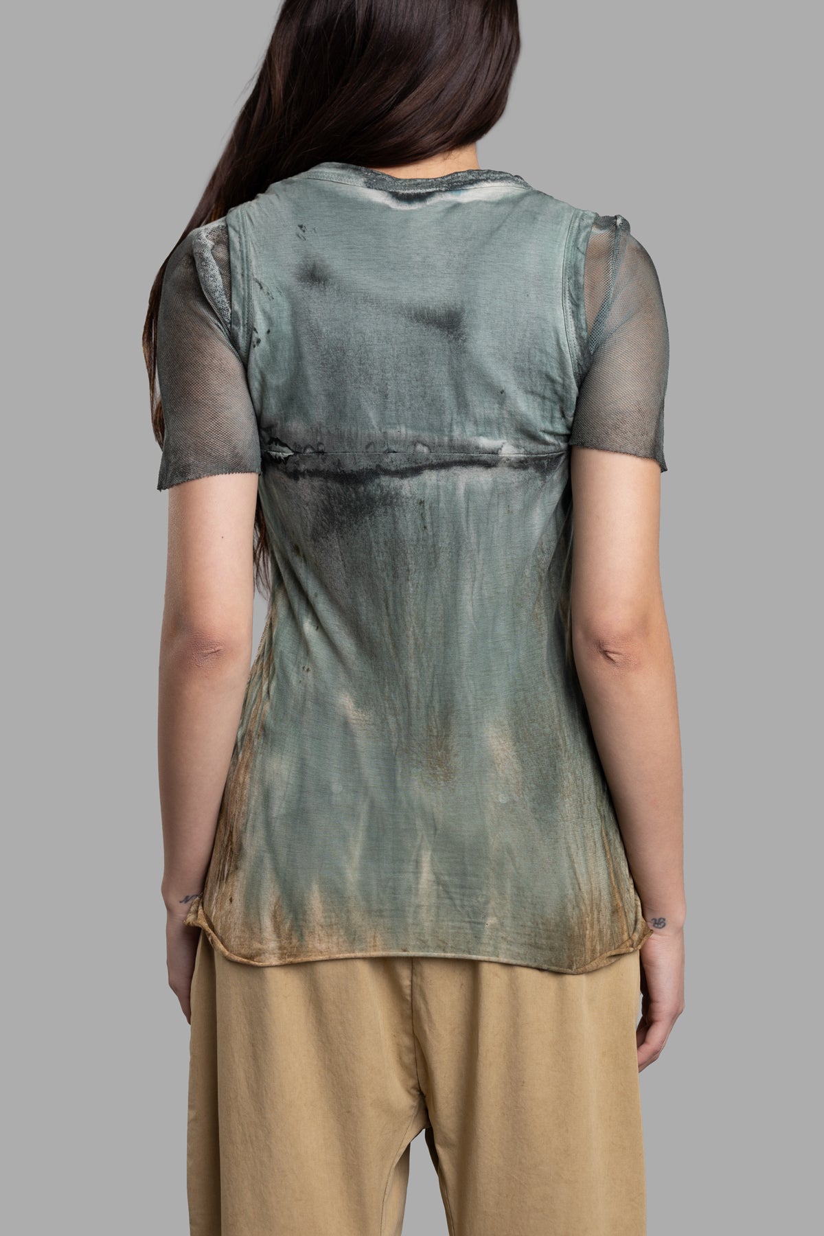 Masnada Layered T-shirt showing the back view, featuring a breathable mesh bottom and unique petrol color design.