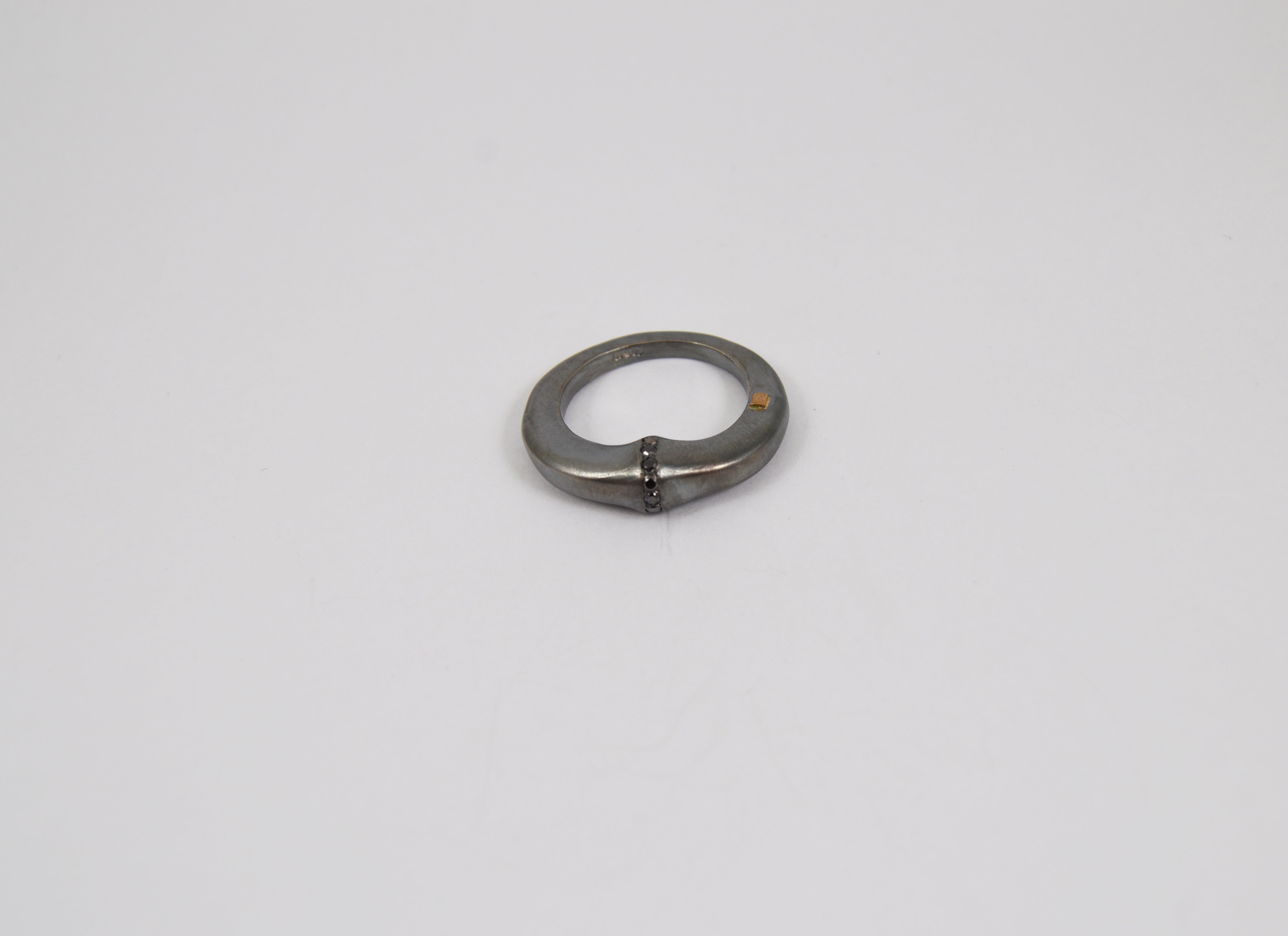 Rosa Maria Kena Ring in silver with black diamonds, showcasing organic design and handcrafted detail on white background.