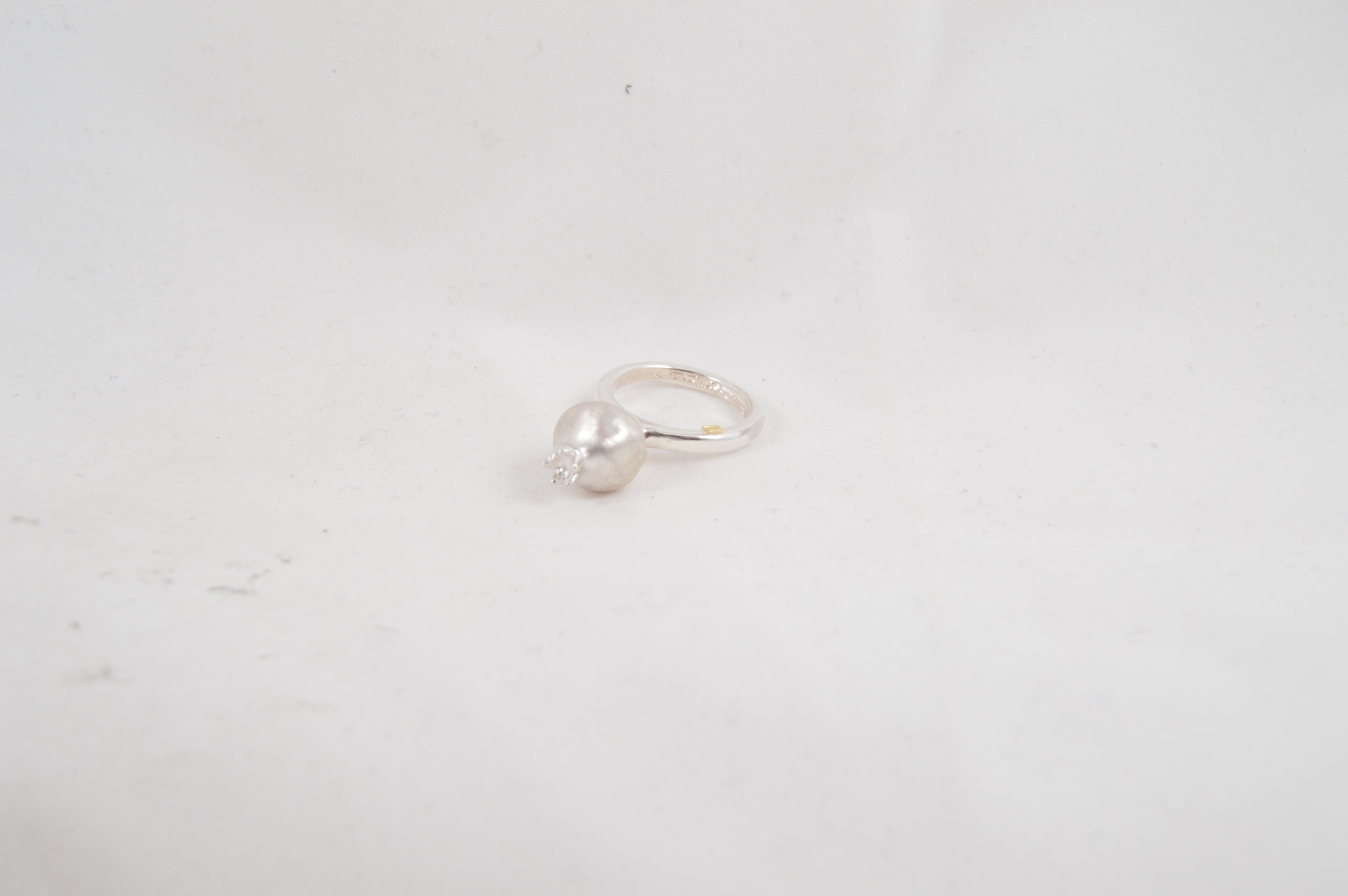 Rosa Maria Mariko Ring showcasing sterling silver with raw organic design on a white background, side view.