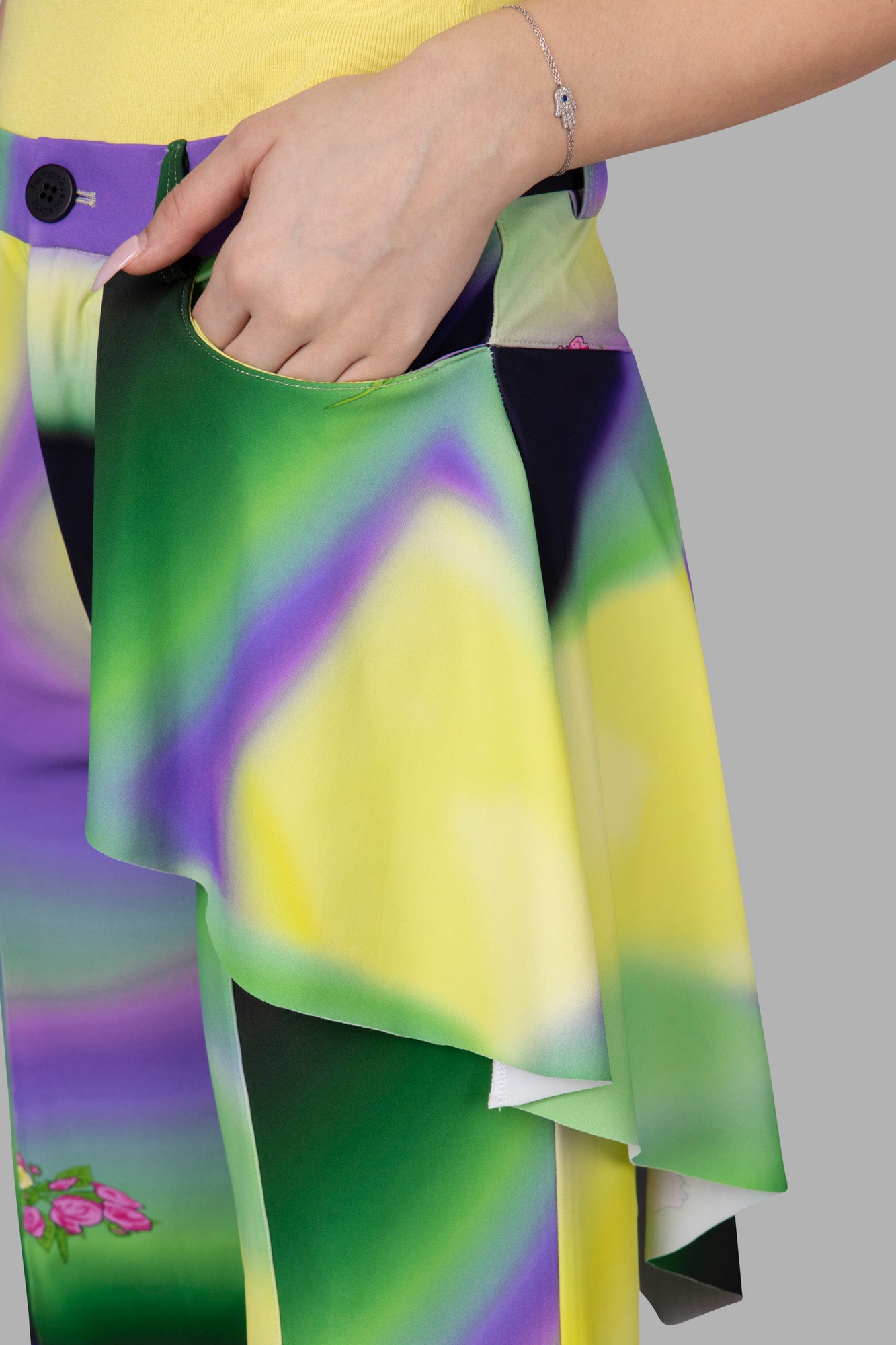 Natasha Zinko Ombré Print Trousers close-up of peplum waistline and vibrant multicolor pattern with side pocket detail.