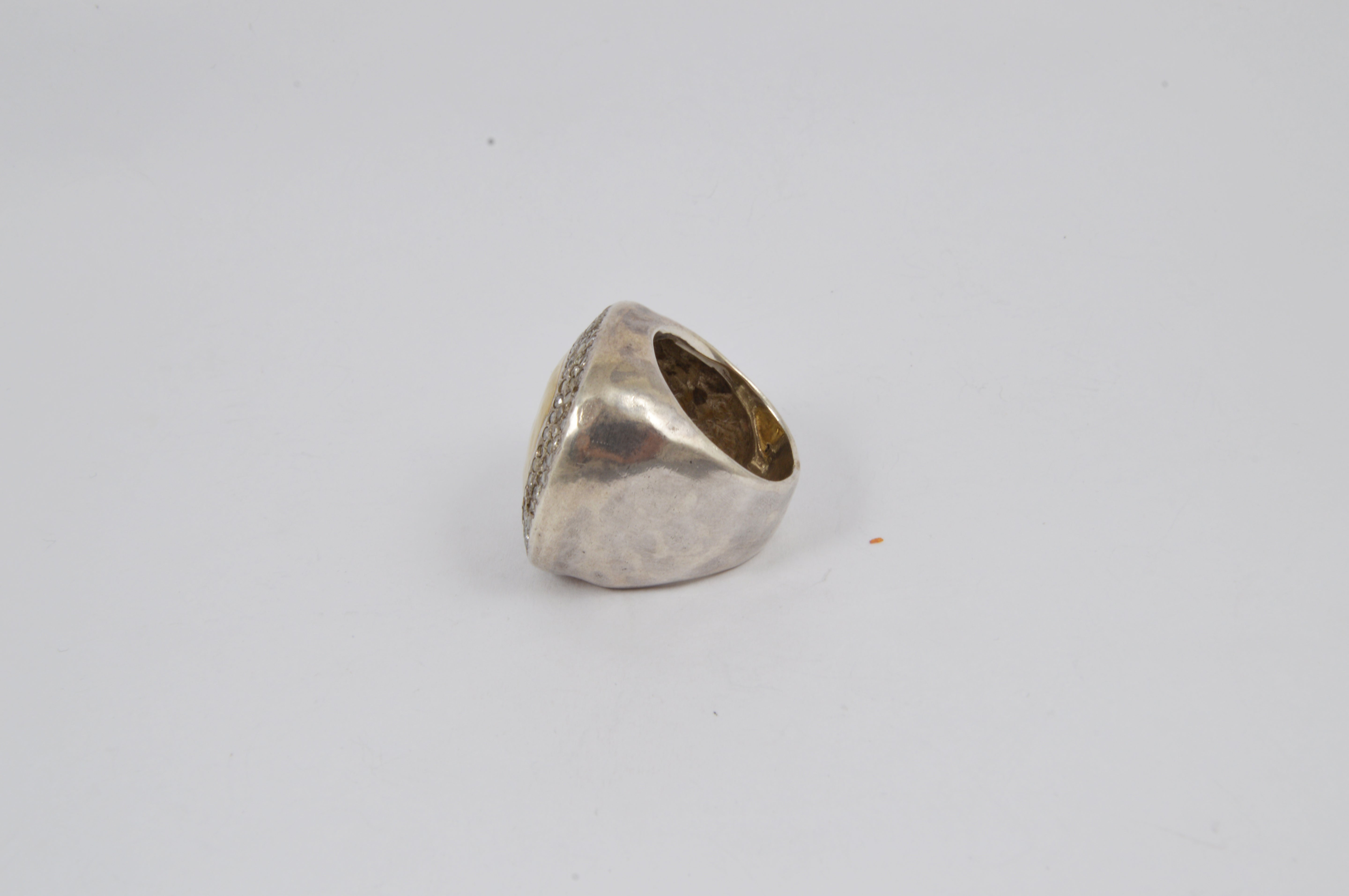 Rosa Maria Odeya Ring showcases raw organic shapes in sterling silver, accented with yellow gold and diamonds. Side view.