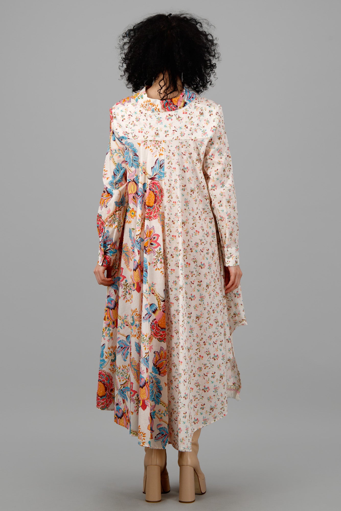 Anjuna Double-Print Asymmetric Dress in multicolor, showcasing a dramatic asymmetrical hem and playful floral patterns.