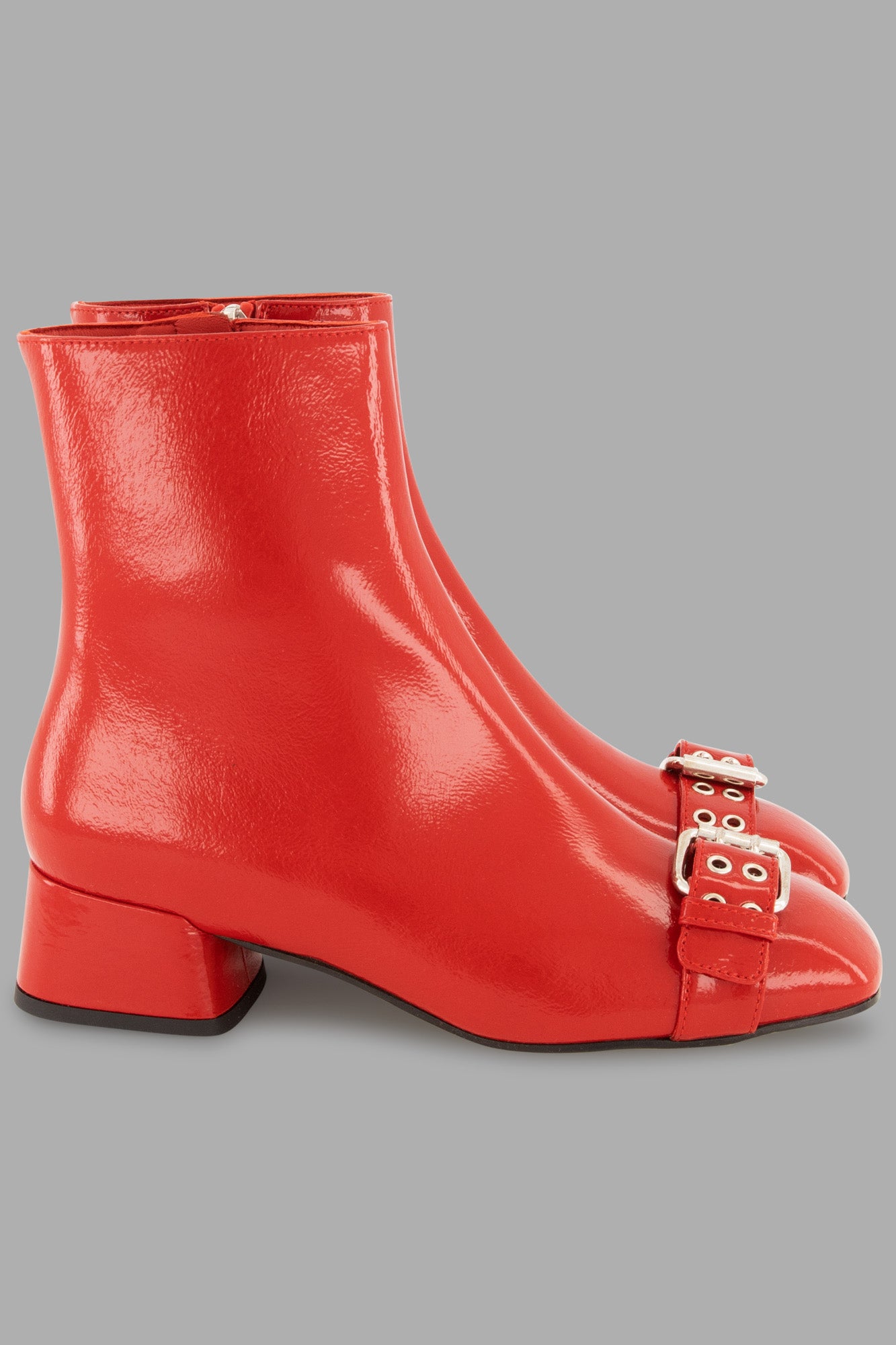 MSGM red latex boots side view with front buckle and side zip fastening, perfect for fall-winter fashion.