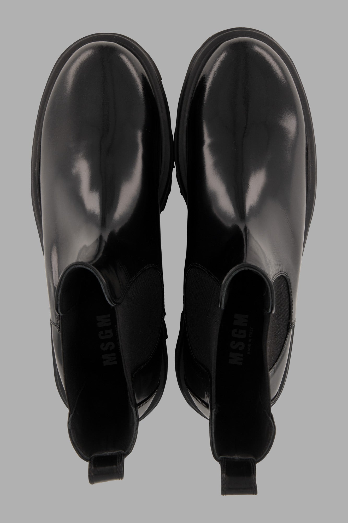 MSGM Chelsea Boots in black, showcasing a glossy finish and rounded toe with convenient pull tab for easy wear.