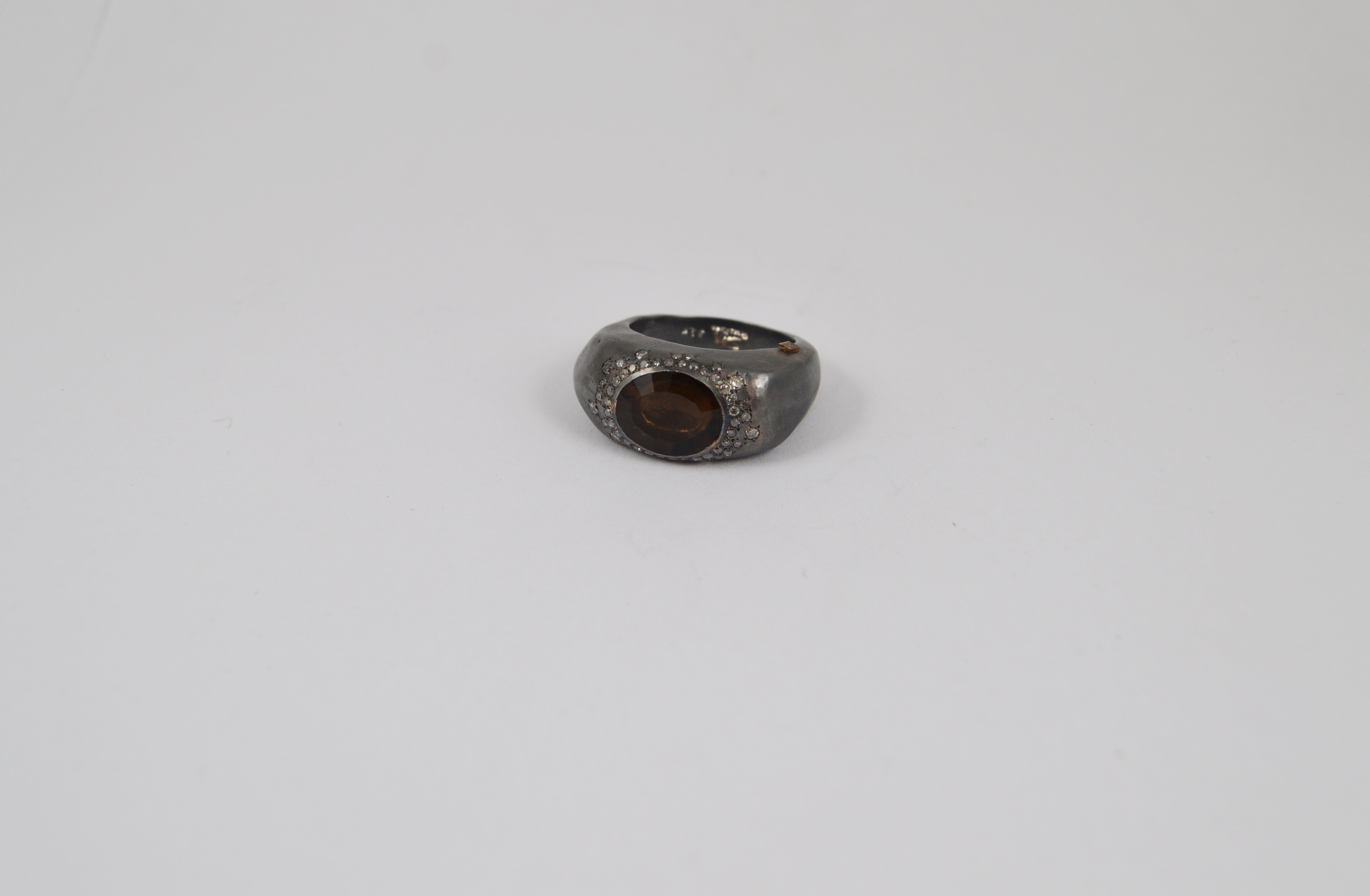 Rosa Maria Padma Ring featuring a smoky quartz stone set in a handcrafted silver band with icy grey diamonds, front view.