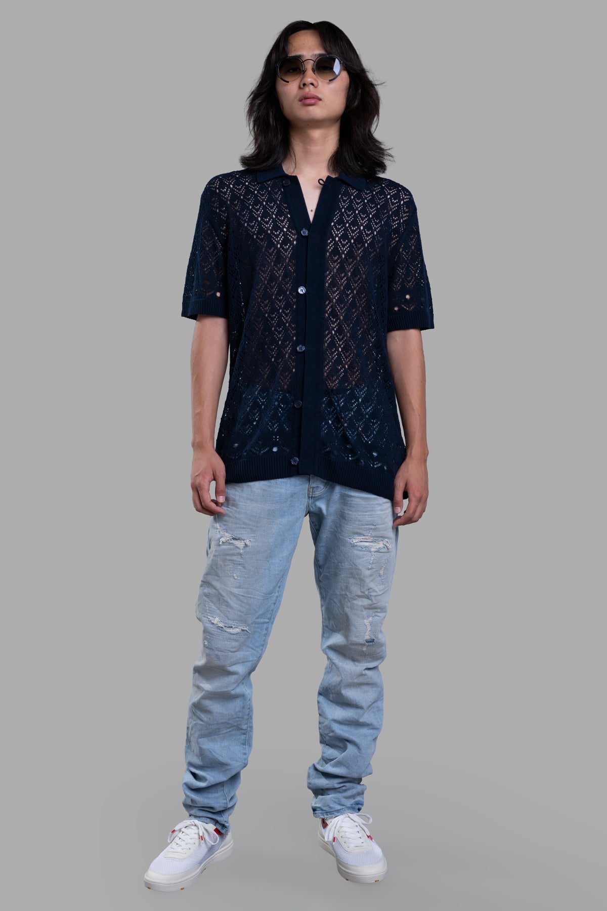 Orlebar Brown Button-Down Knit Shirt, front view, on-model with sunglasses; features intricate pattern design. Image 1.