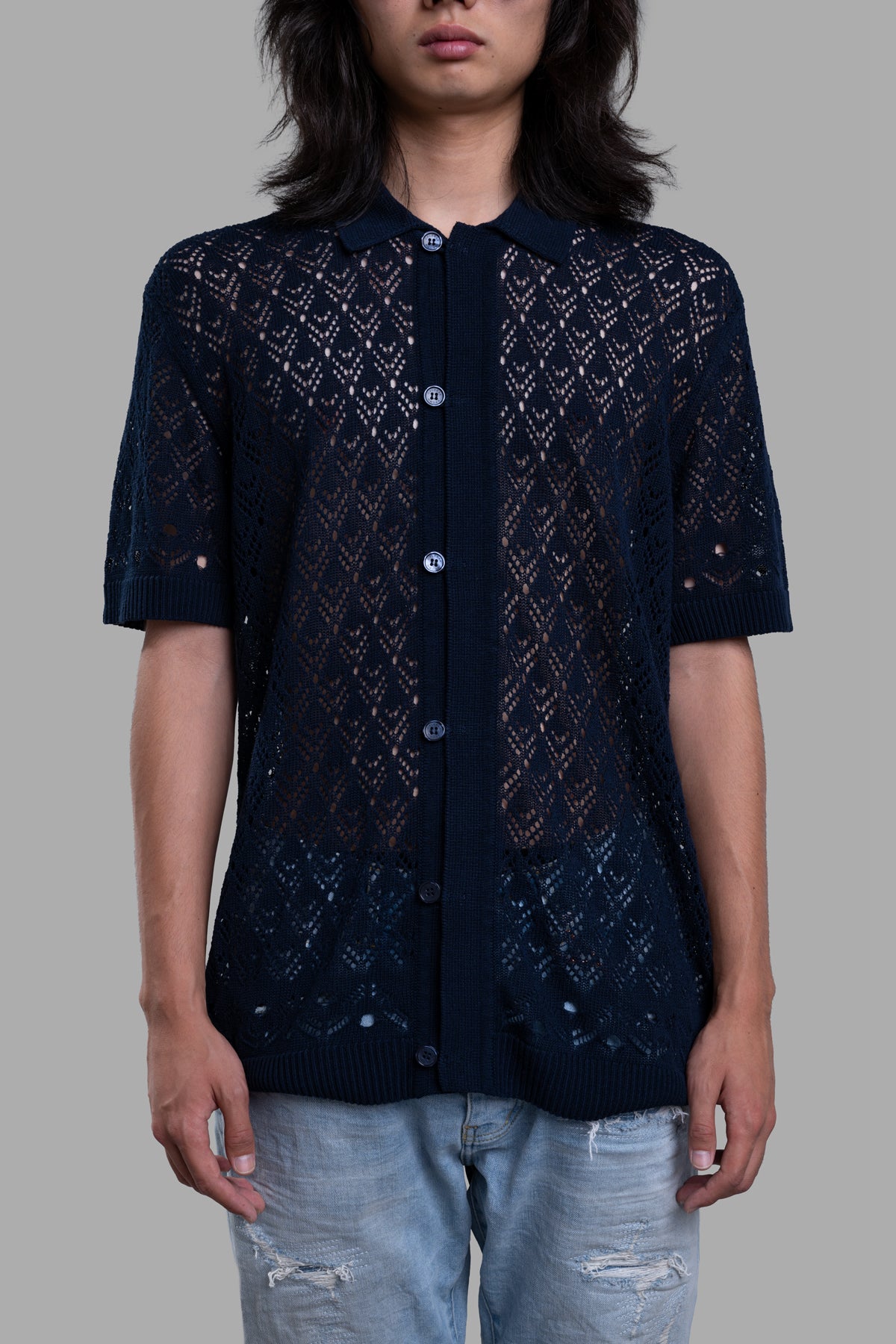 Orlebar Brown Button-Down Knit Shirt, displayed front view, featuring intricate knit pattern and buttons, modeled casually.