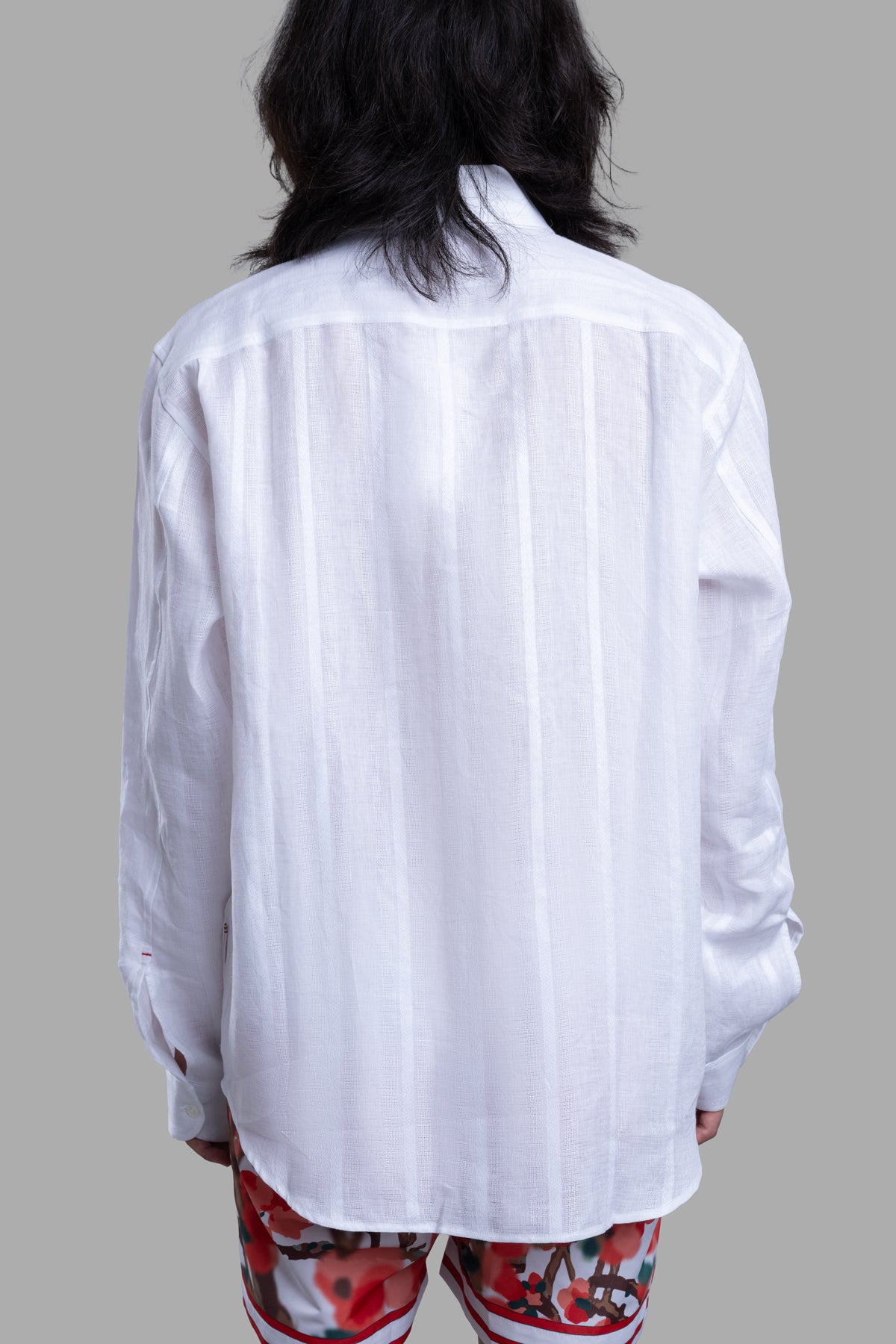 Orlebar Brown Resort Overshirt in white, showcasing the textured linen fabric and modern cutaway collar from the back.