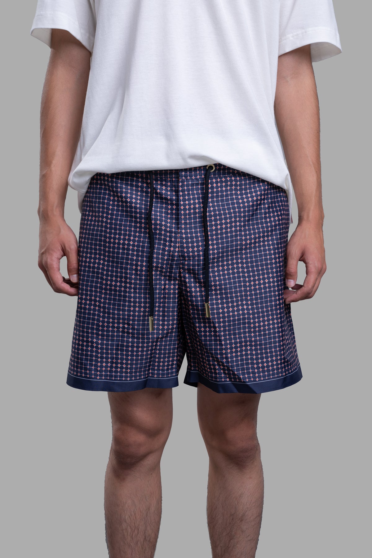 Orlebar Brown Drawcord Swim Shorts featuring a blue and red diamond print, shown from the front on a model.