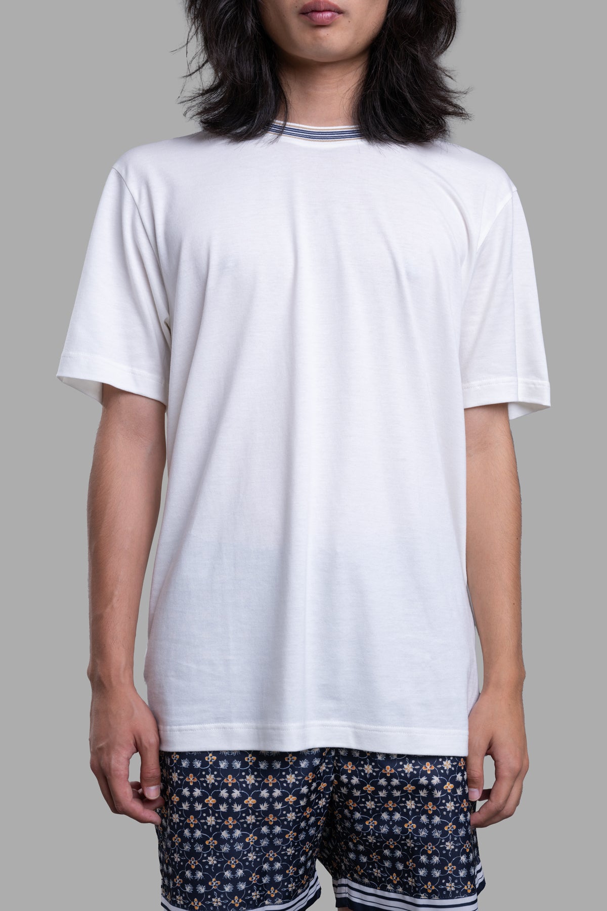 Orlebar Brown Striped Neckline T-shirt featuring a ribbed neckline and relaxed fit, modeled in ecru, paired with patterned.