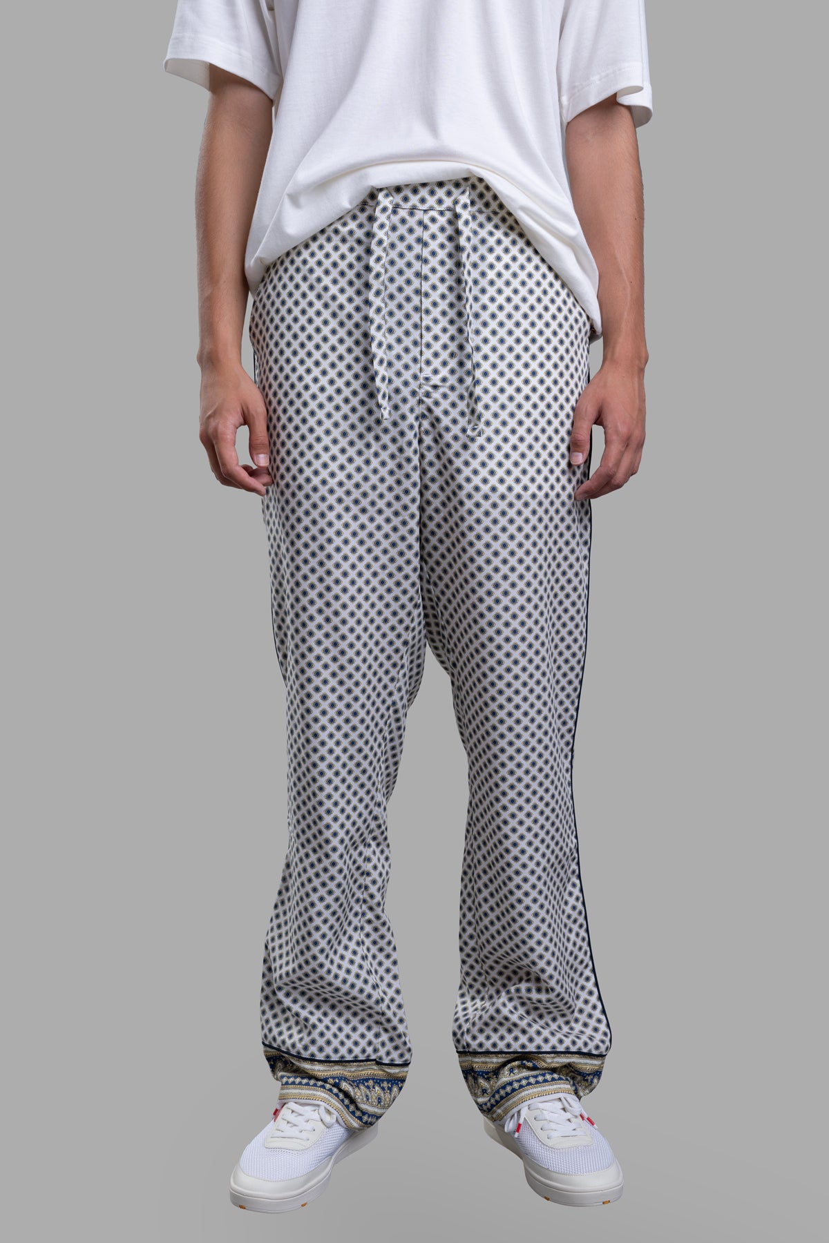 Orlebar Brown Relaxed-Fit Lounge Trousers shown on a model, featuring a patterned design and adjustable waistband for.