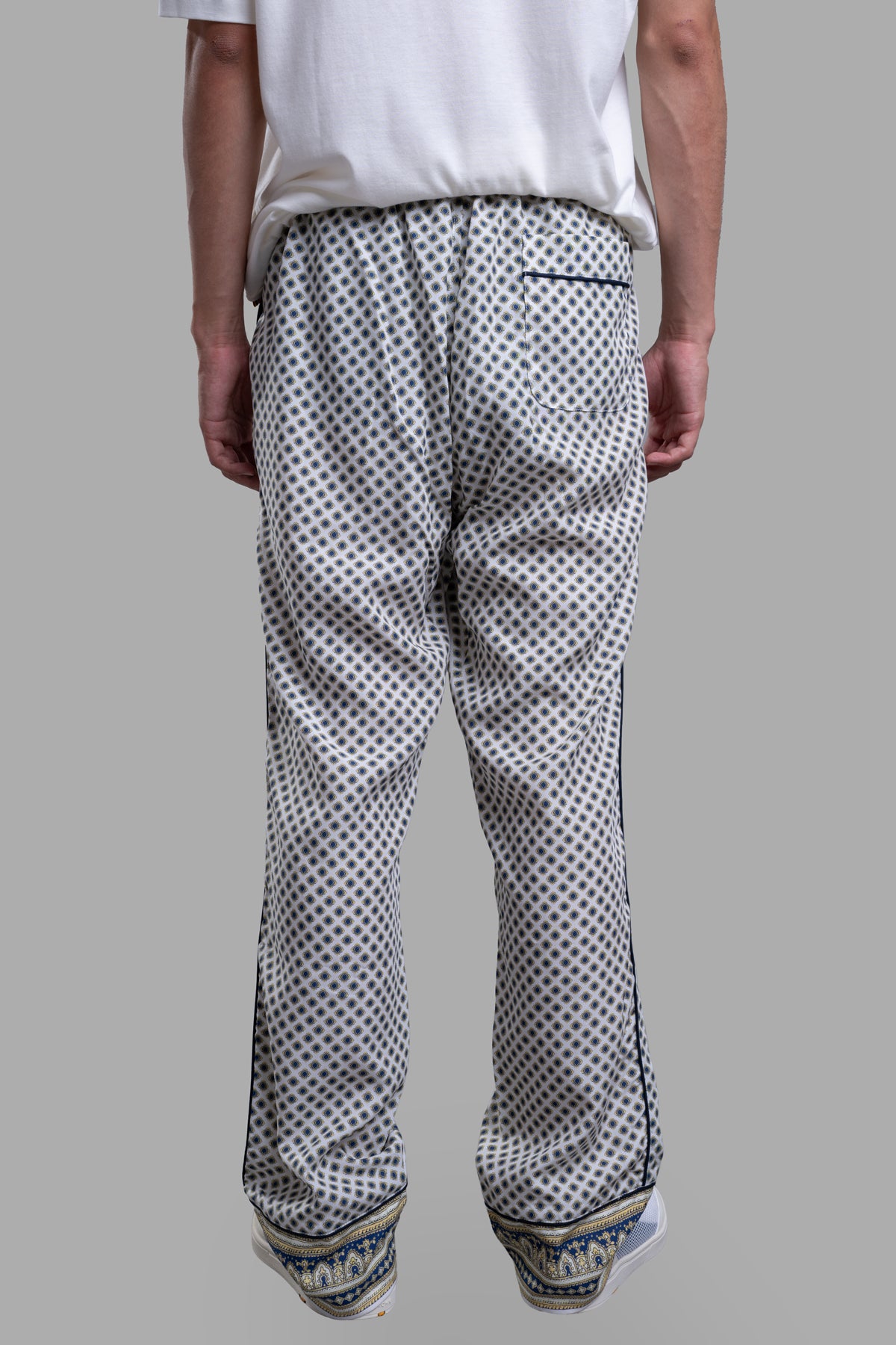 Orlebar Brown Relaxed-Fit Lounge Trousers, featuring a unique floral print, part-elasticated waistband, and paisley hem.