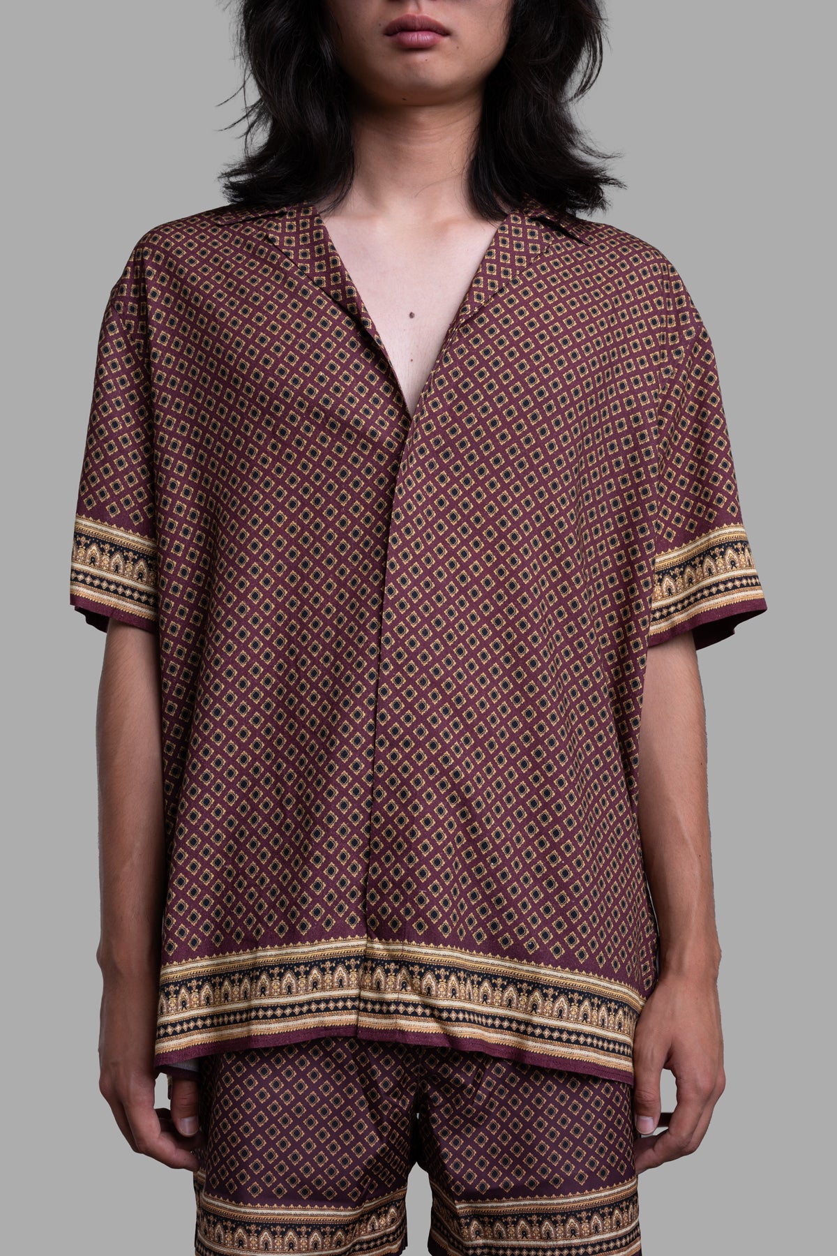 Orlebar Brown Relaxed-Fit Capri Shirt in deep red, featuring floral print and paisley details, modeled with relaxed fit.