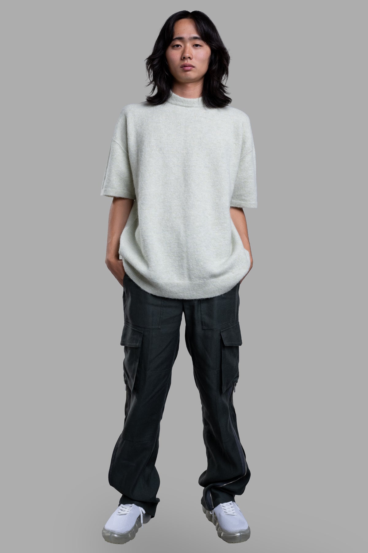 Helmut Lang Cargo Carpenter Pants, front view on model, showing full-length design and pocket details.