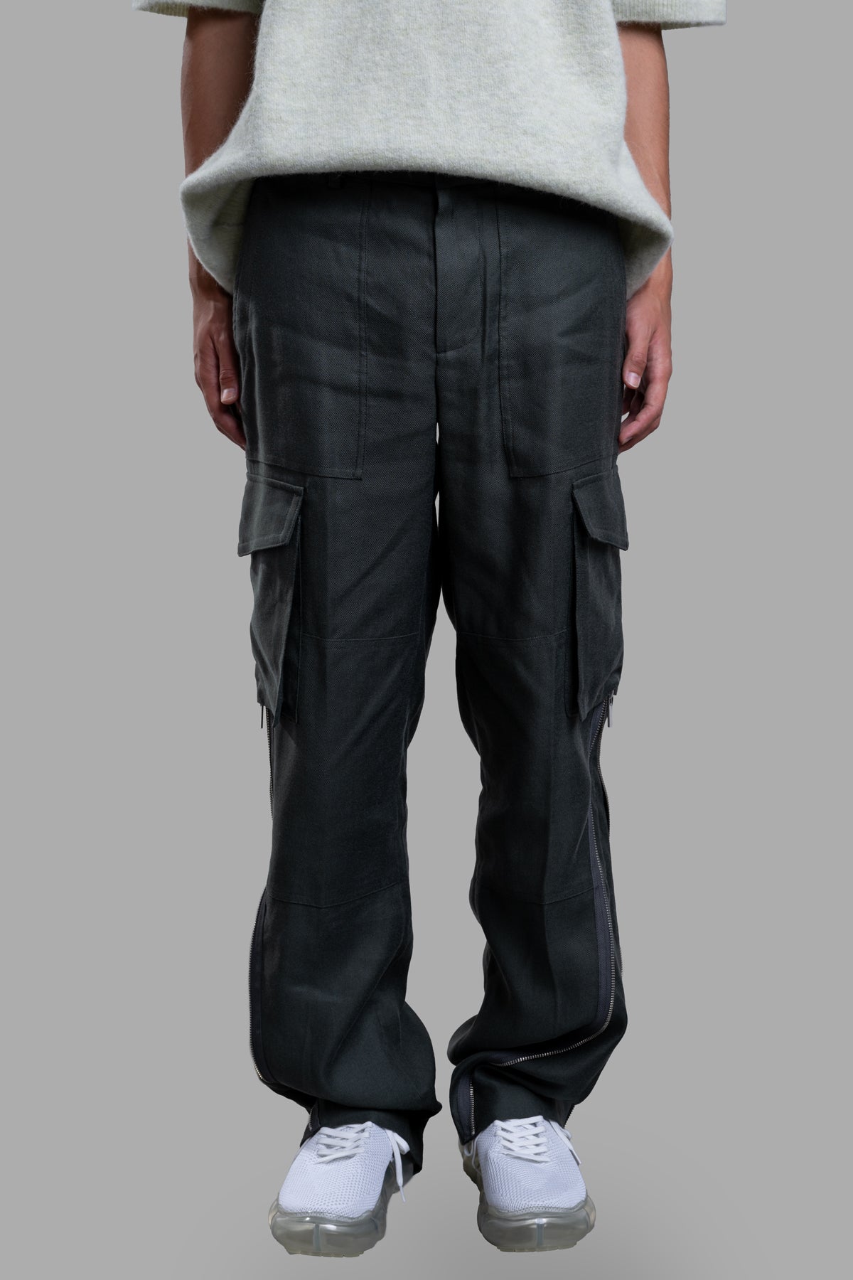 **Alt text:** Helmut Lang Cargo Carpenter Pants displayed on-model, showcasing front details and spacious side pockets.