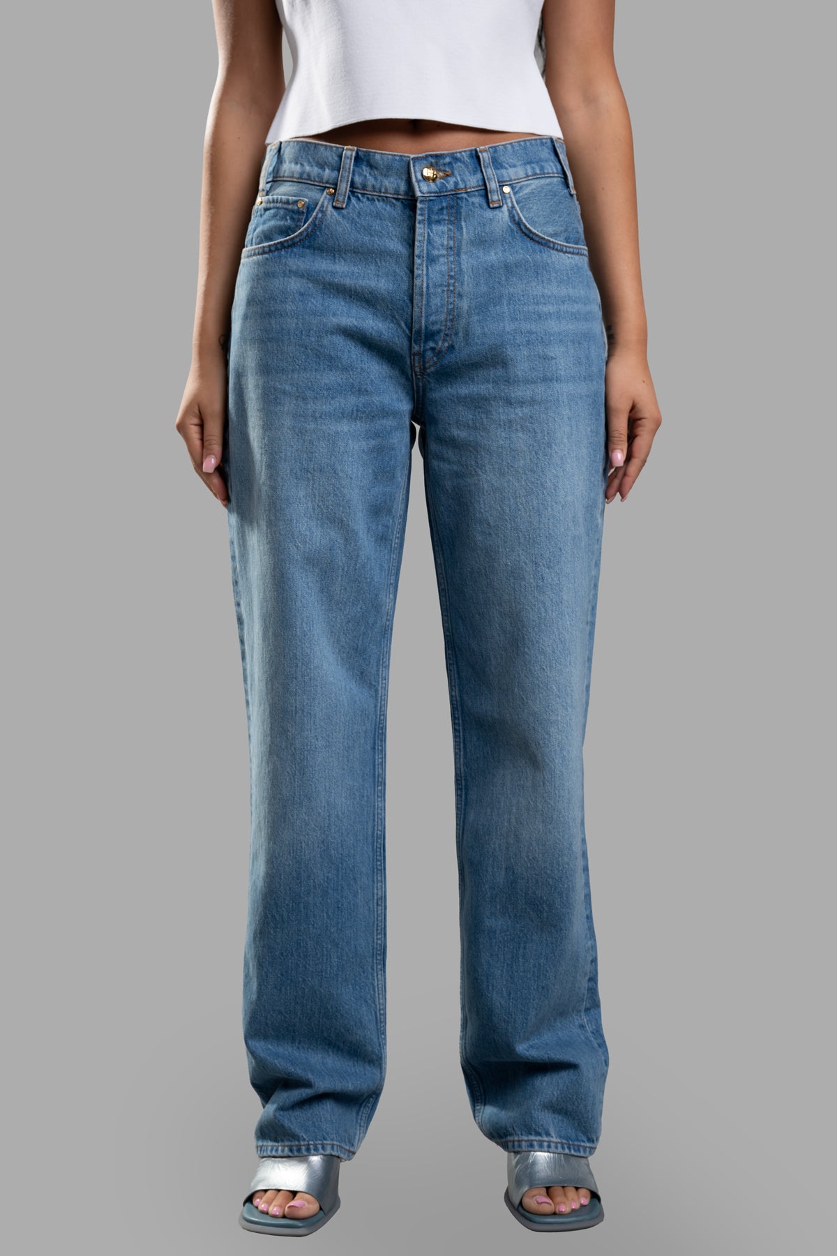 Anine Bing Straight-legged Jeans, front view on model, showcasing organic denim with a classic five-pocket design in blue.