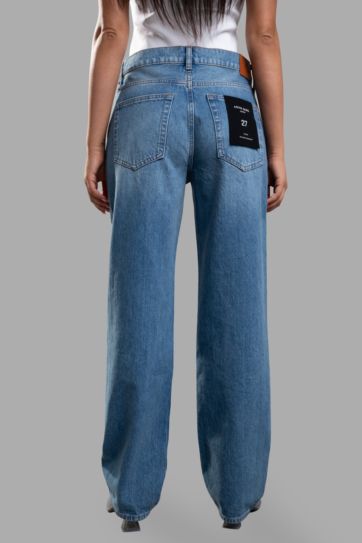 Anine Bing Straight-legged Jeans showcased from the back, featuring a classic five-pocket design and logo patch.