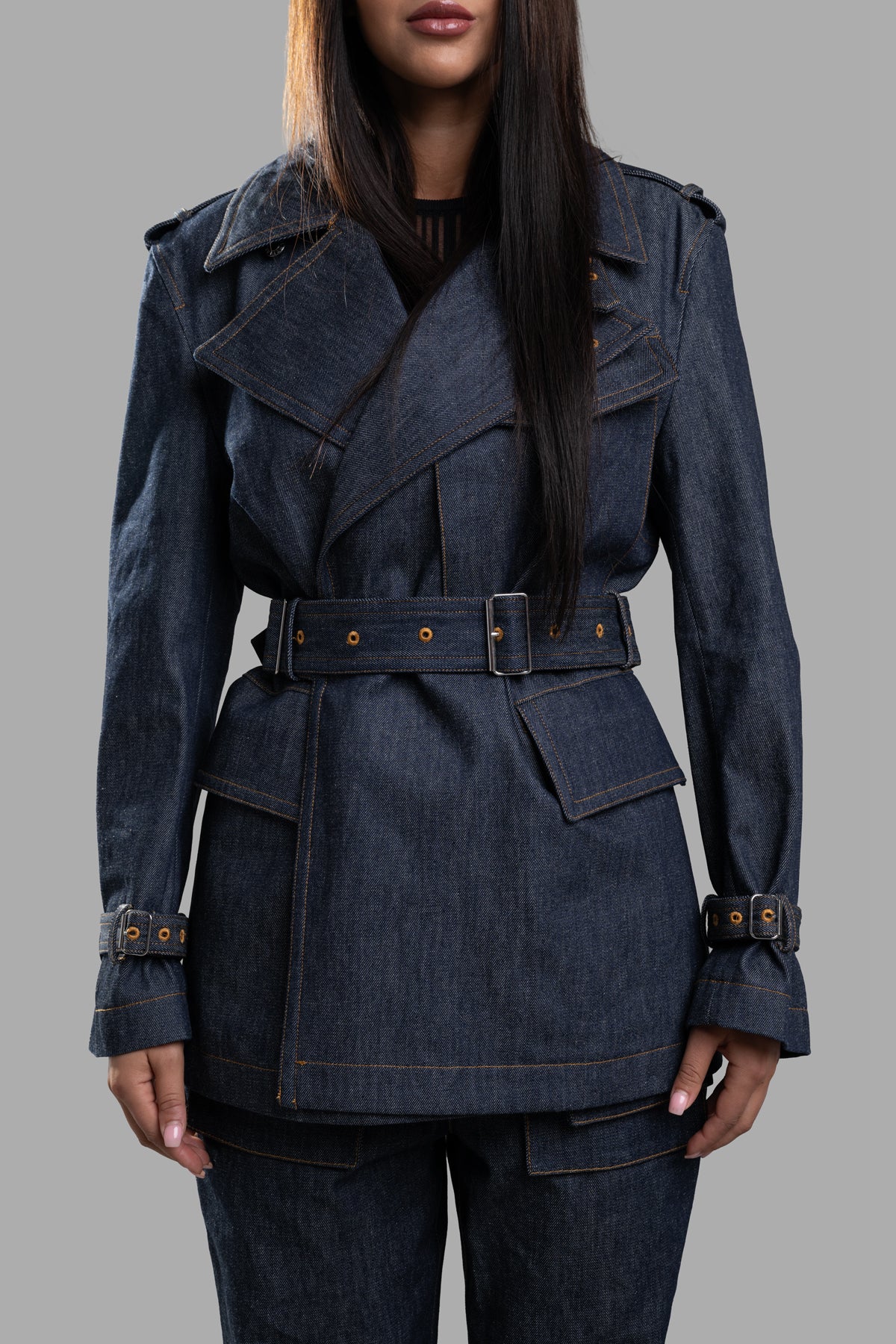 Helmut Lang Denim Trench Jacket featuring oversized lapels, buckle closures, and pocket details in raw indigo denim.