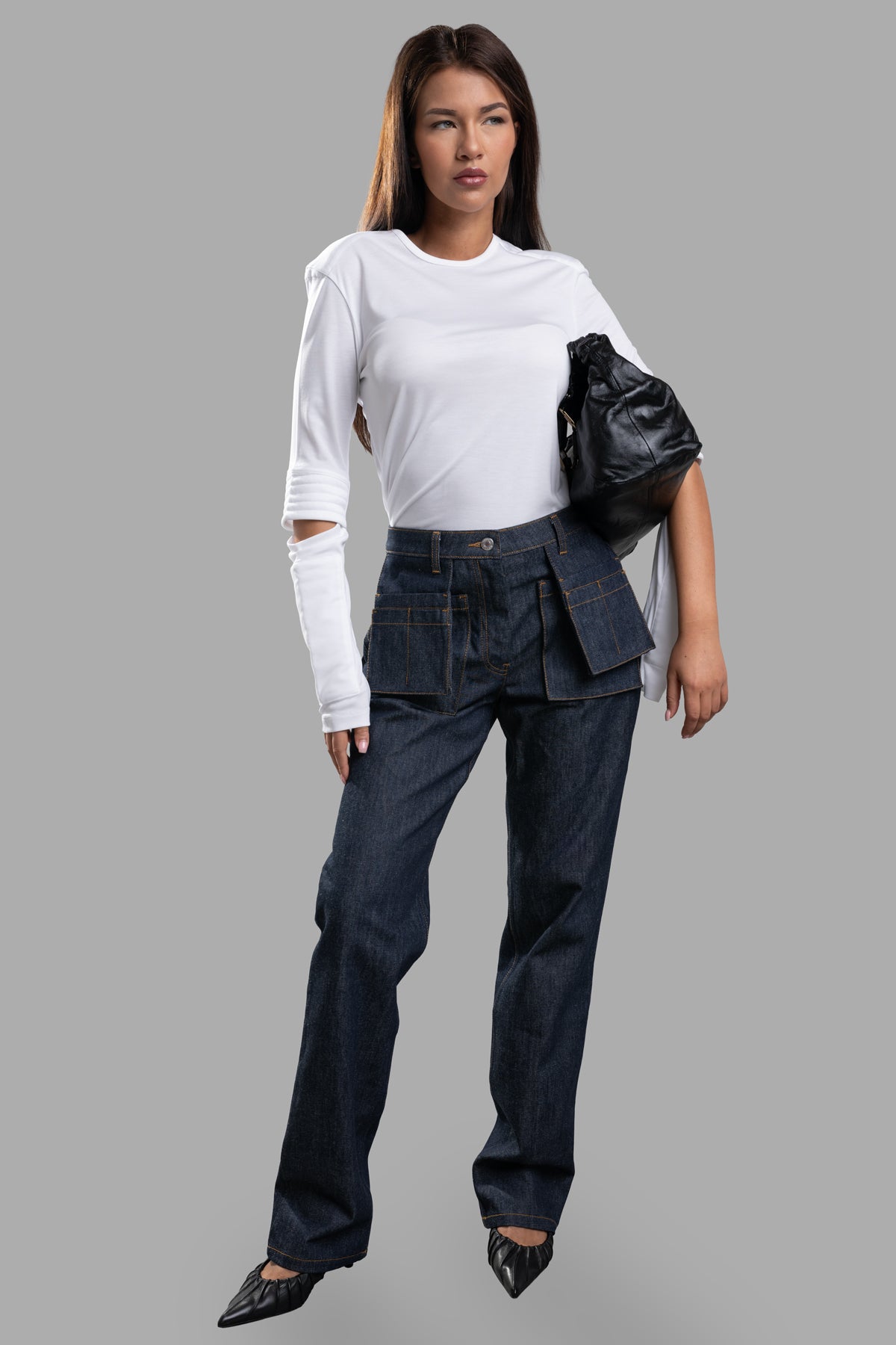 Helmut Lang Utility Jeans in dark blue, modeled with customizable utility pockets on display, crafted from Italian indigo.