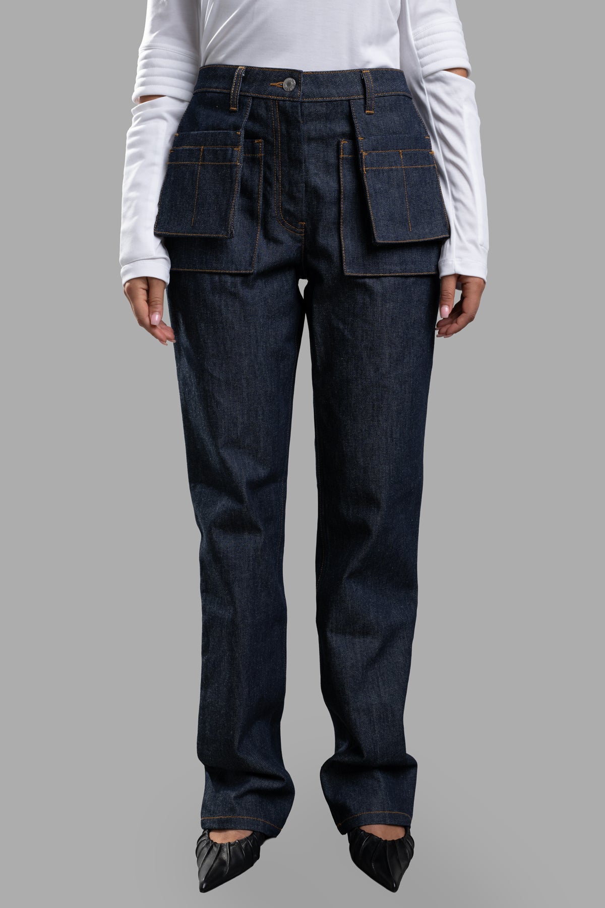 Helmut Lang Utility Jeans crafted from dark blue Italian raw indigo denim, featuring hidden utility pockets for versatility.
