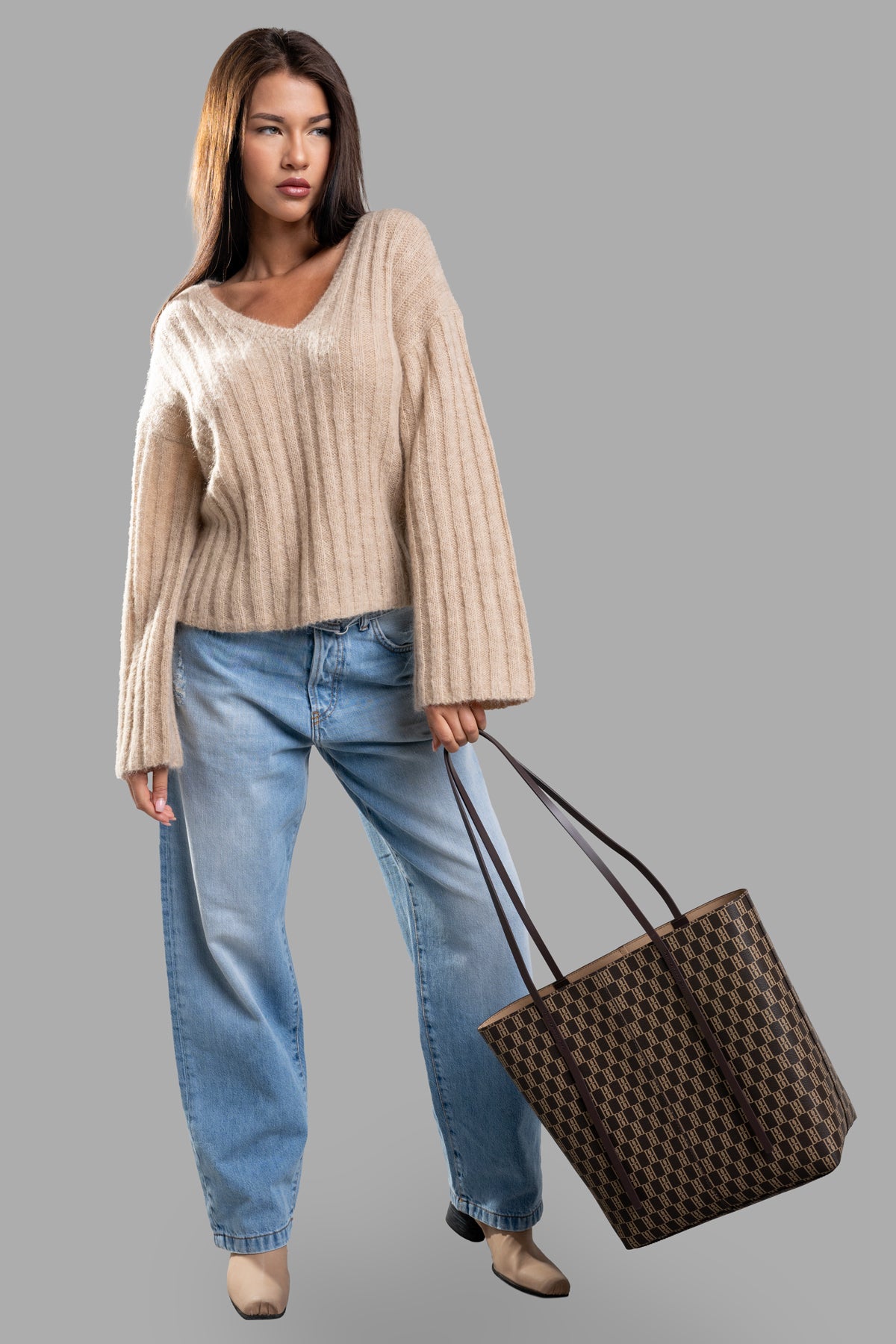 By Malene Birger Cimone Ribbed Sweater in beige, front view on model with relaxed V-neck and wide sleeves.