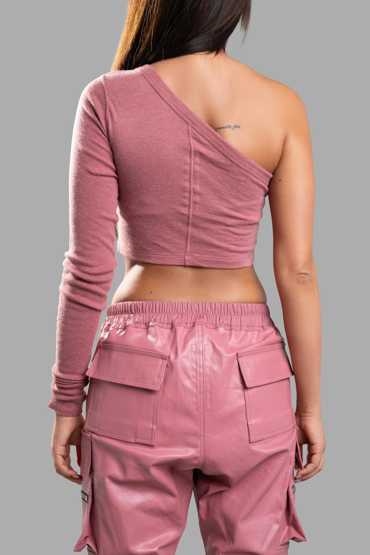 Rick Owens Ziggy Asymmetric Top in pink, featuring a stylish one-sleeve design, shown from the back on a model.