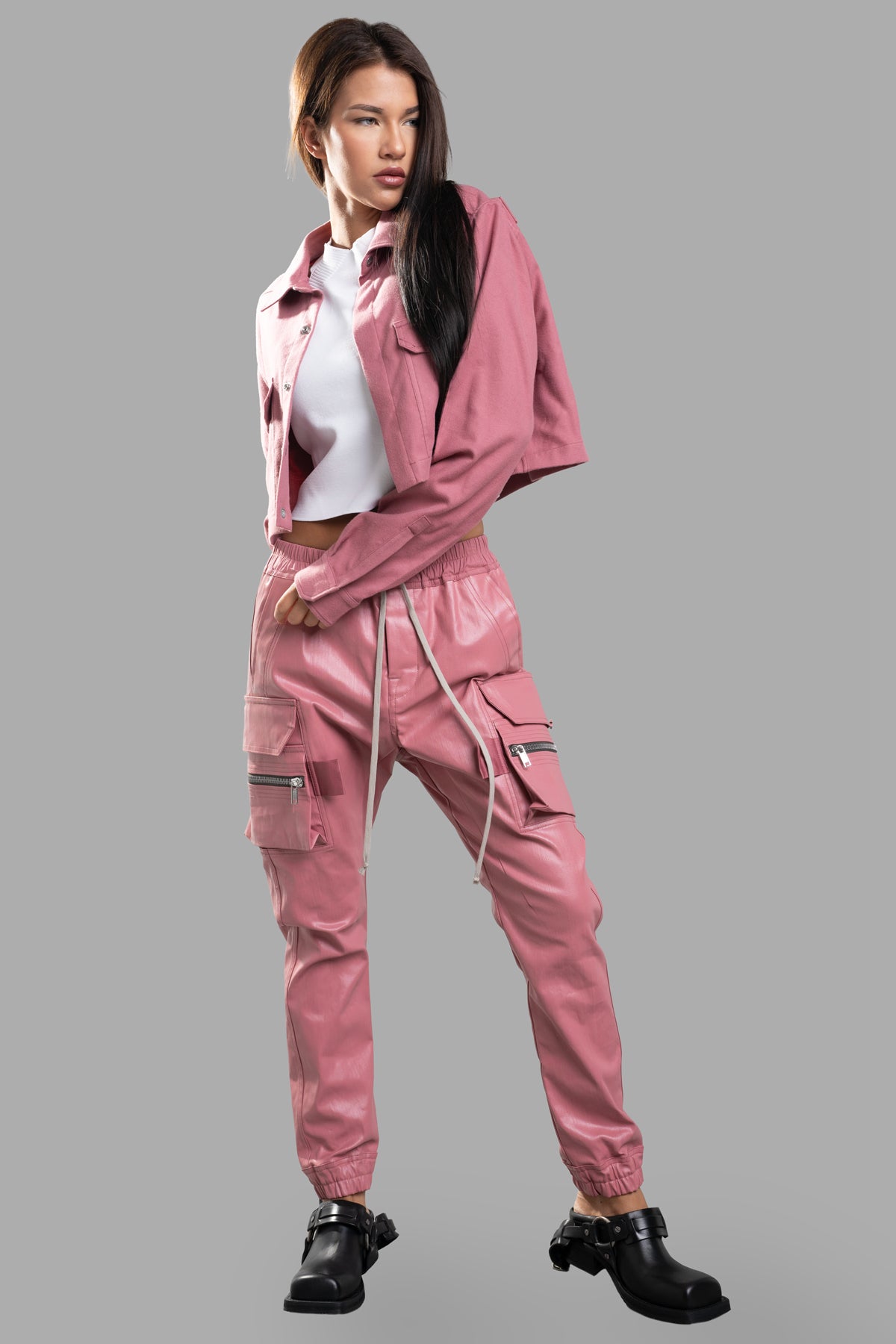 Rick Owens Cropped Outershirt in pink, front view on-model, featuring snap closures and functional flap pockets, cotton fabric.