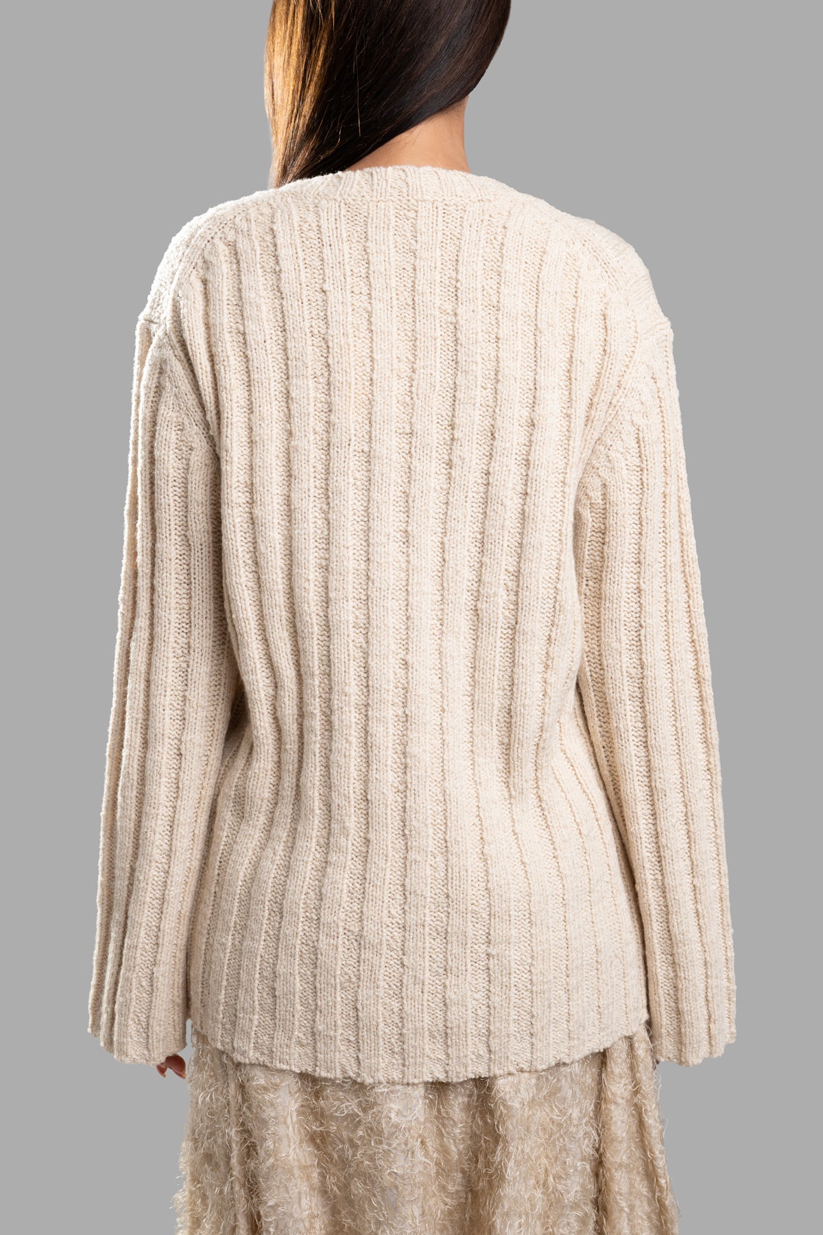 By Malene Birger Cirra Ribbed Sweater, ecru, showcasing a cozy back view with textured ribbing and slouchy silhouette.