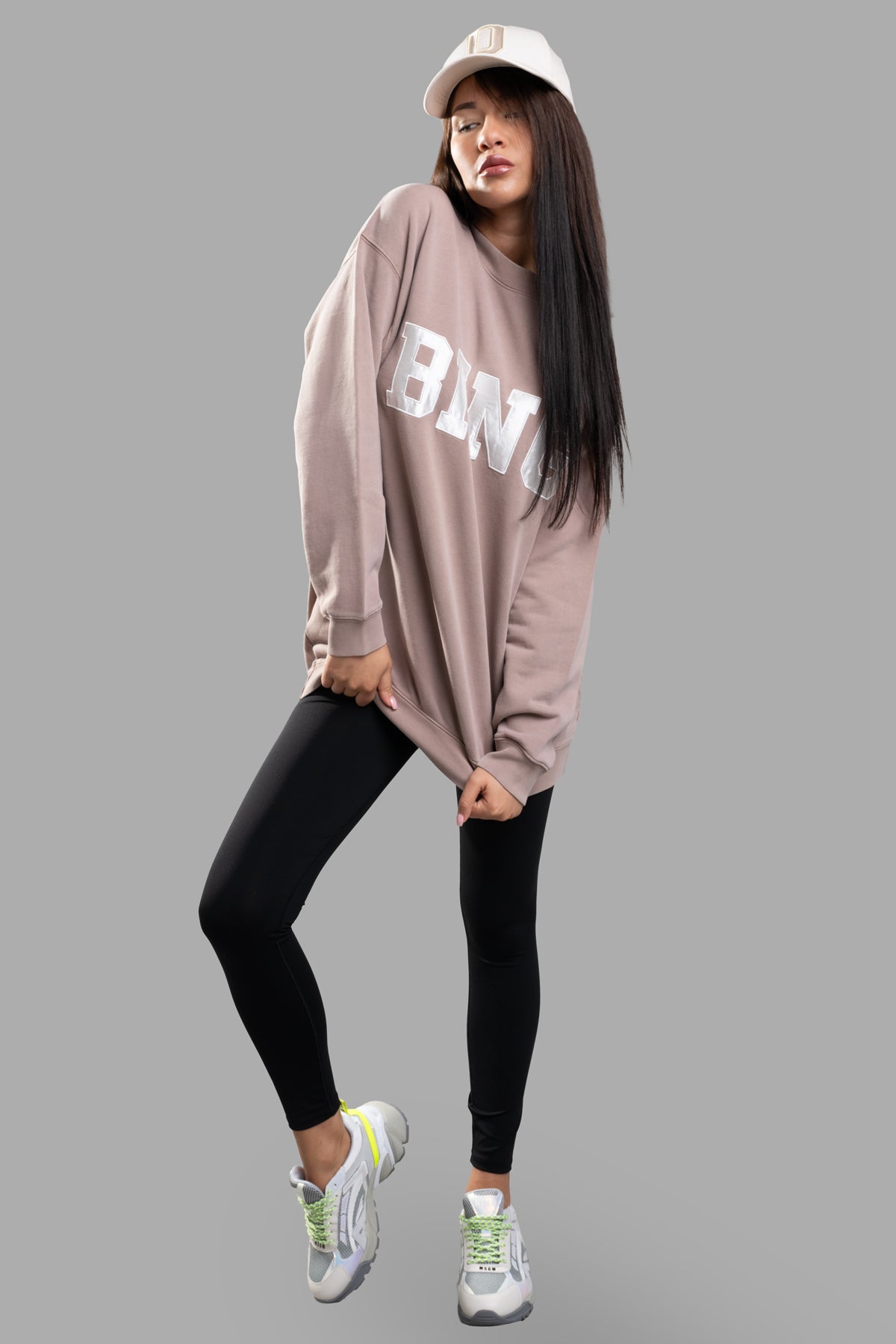 Anine Bing Tyler Logo Sweatshirt in purple, oversized fit, modeled front view with ivory collegiate lettering detail.