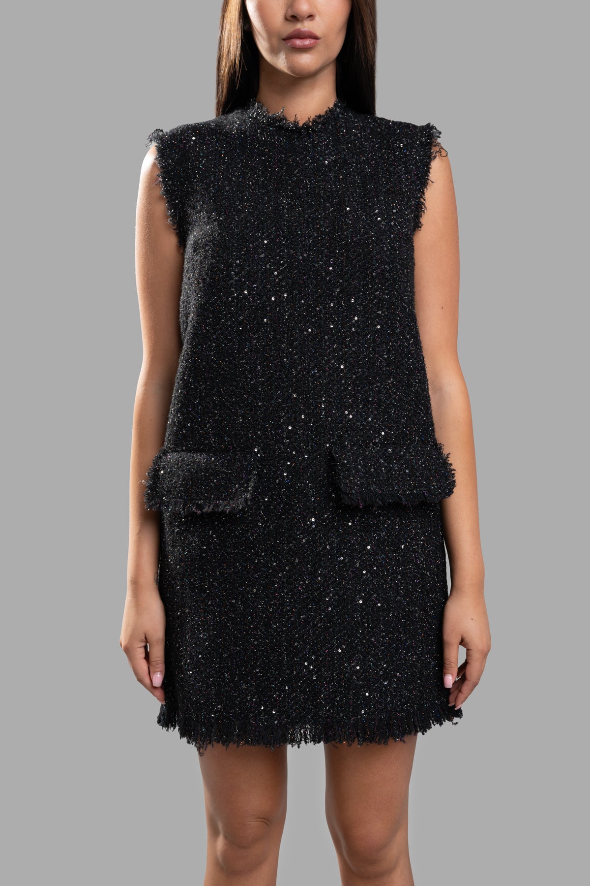 MSGM Tweed Mini Dress in black, featuring sequin details, frayed edges, round neck, and two front flap pockets.