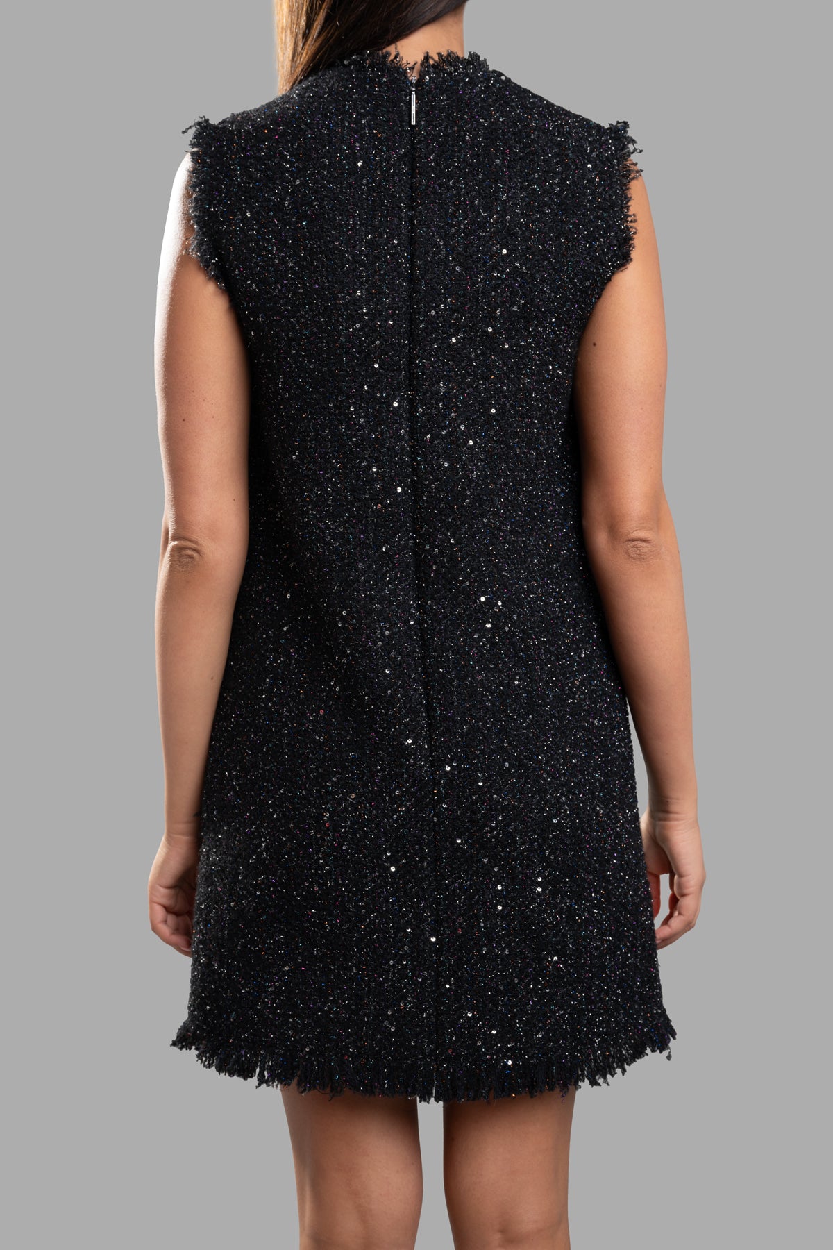 MSGM Tweed Mini Dress showcasing the back view, featuring sequin embellishments and frayed edges in black.