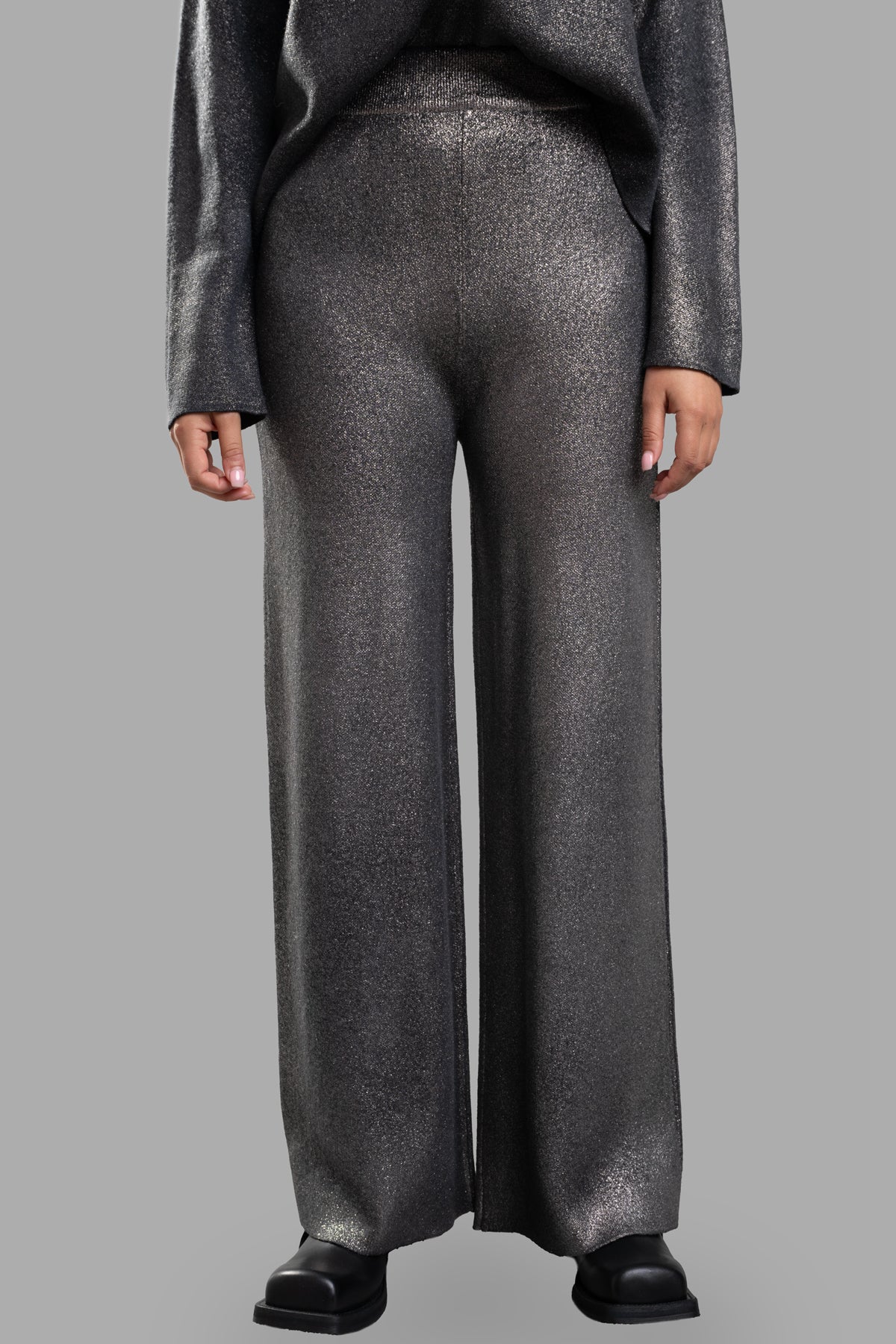 Avant Toi Lamé Knit Pants featuring a high-waisted, wide-leg design in grey/gold with an elasticated waistband.