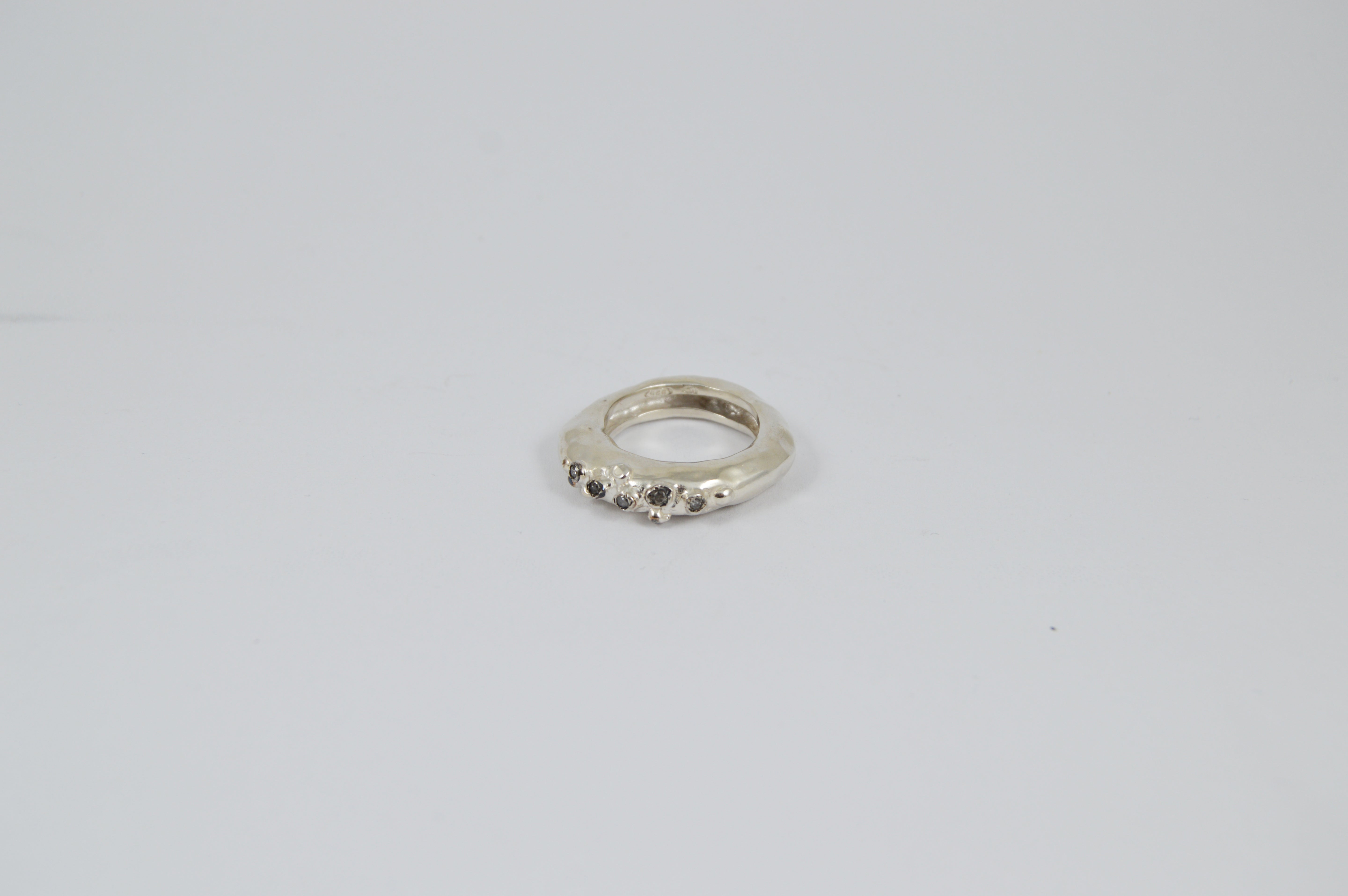 Rosa Maria Razan 1 Silver Ring, showcasing a front view with raw, organic shapes in handcrafted silver.