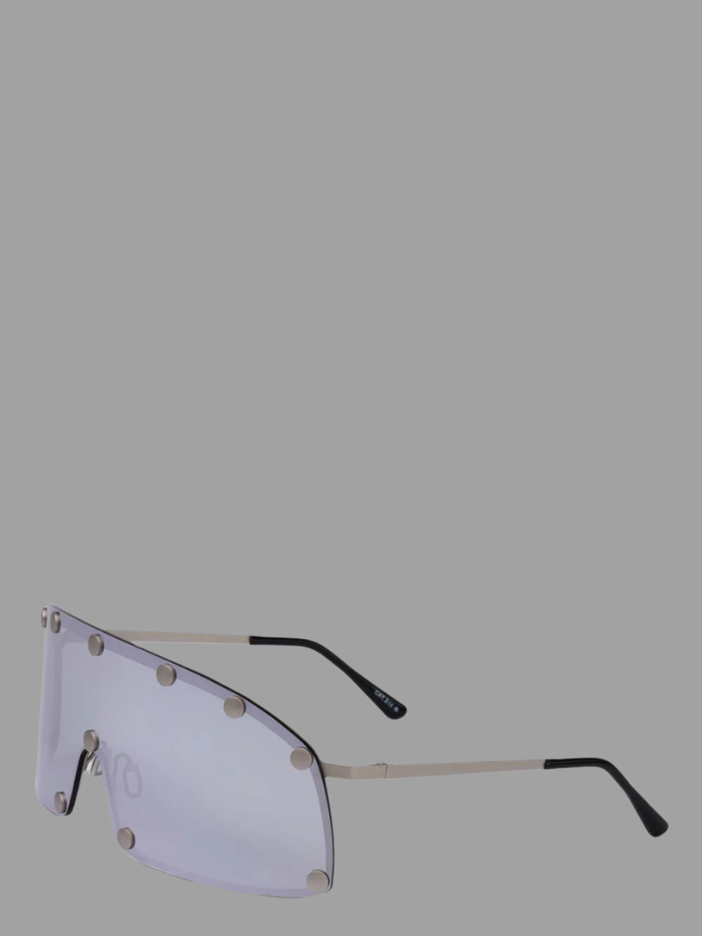 Rick Owens Shielding Sunglasses showcase a sleek profile with black lenses and a modern silver stainless steel construction.