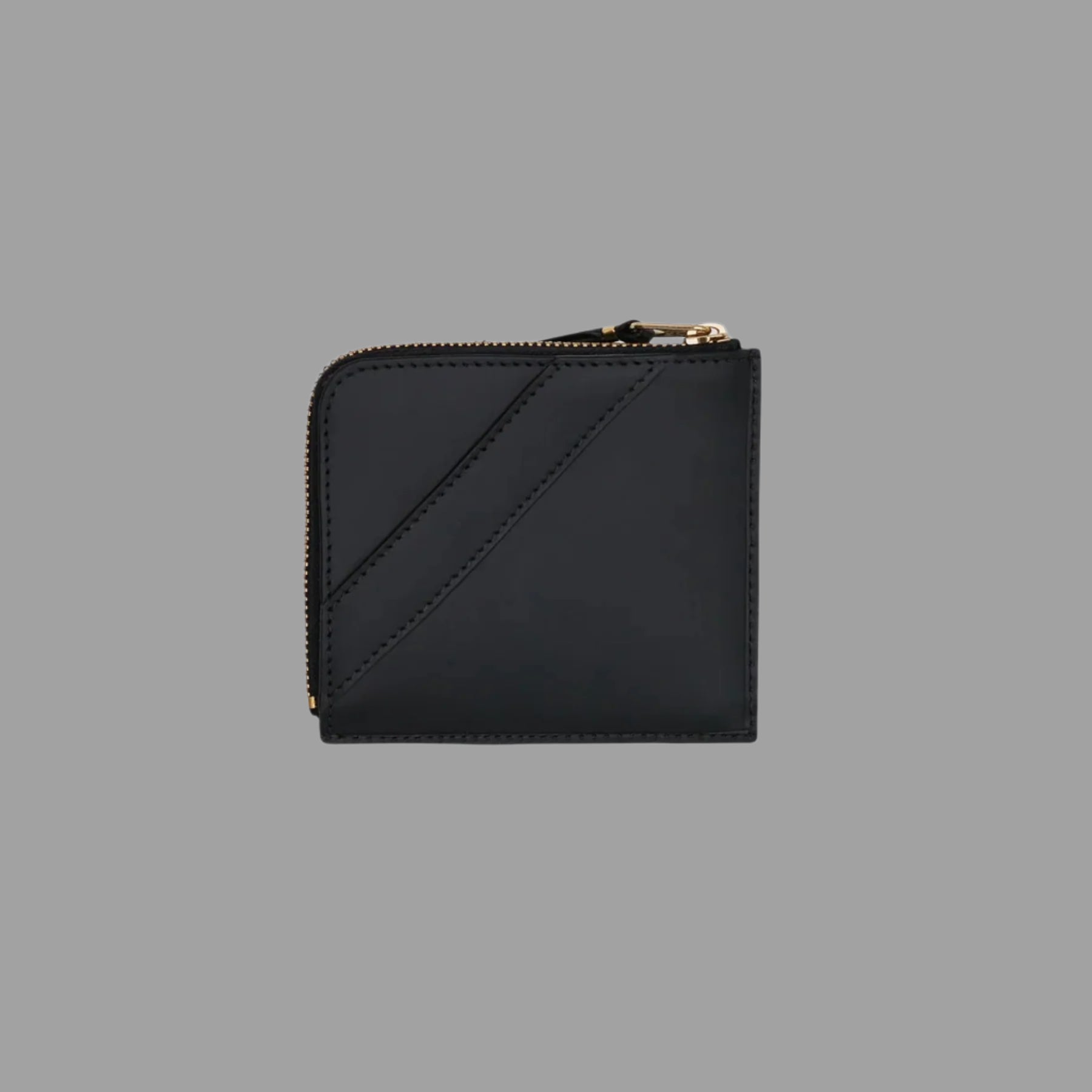 Comme des Garçons Half-zip Bow Wallet in black featuring a large bow detail and luxurious leather front view.