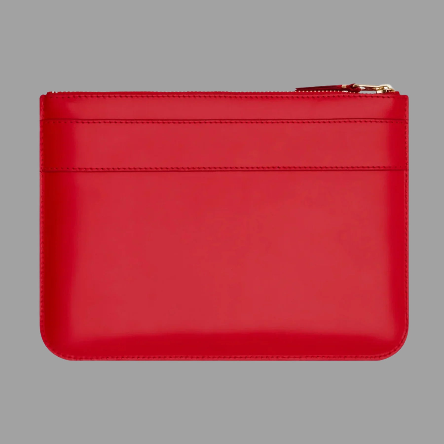 Comme des Garçons Big Bow Purse in Red, showcasing the sleek back view with a smooth finish and zipper detail.