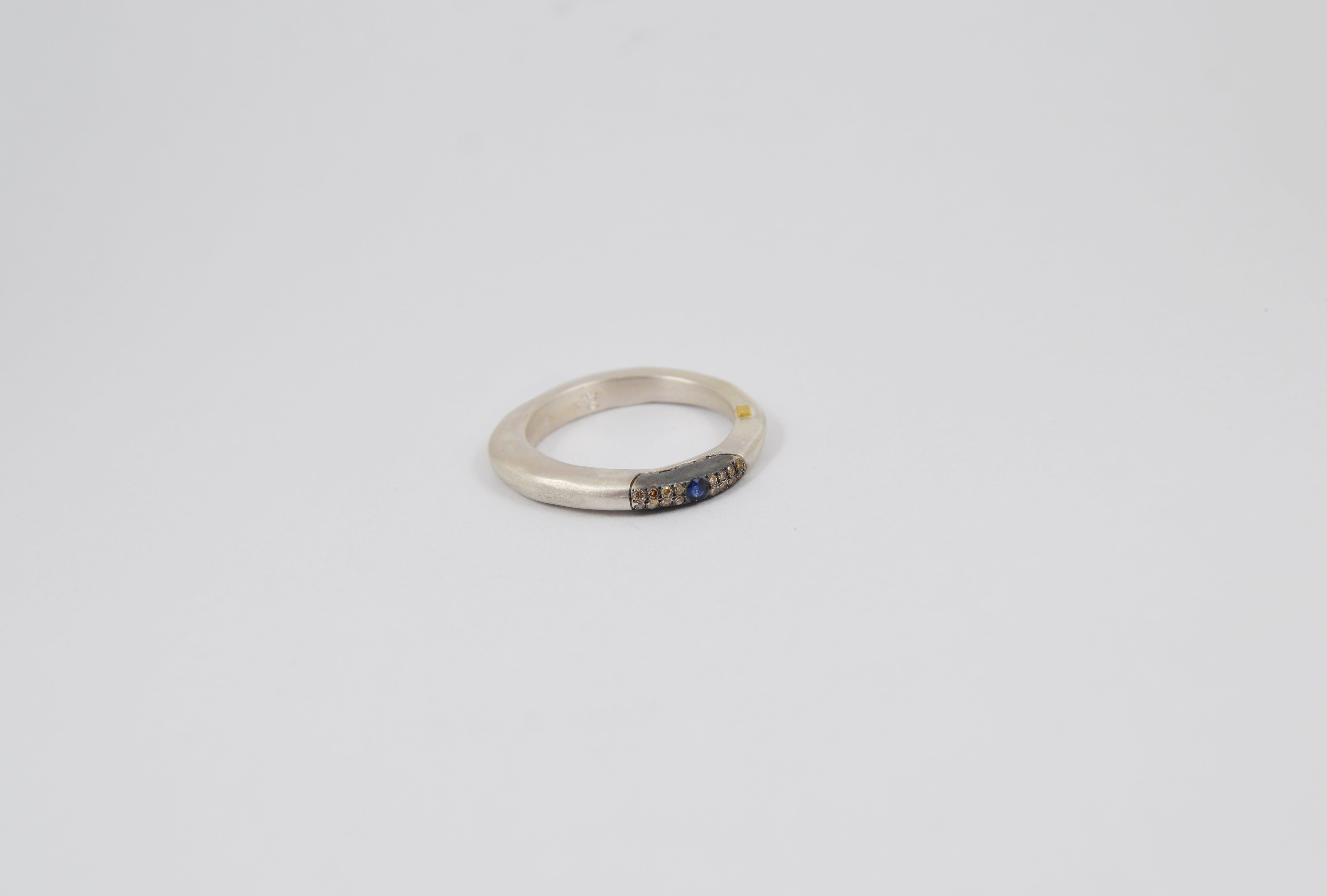 Rosa Maria Sapho Cobalt Ring, front view. Sterling silver band with blue sapphire and cognac diamonds, organic design.