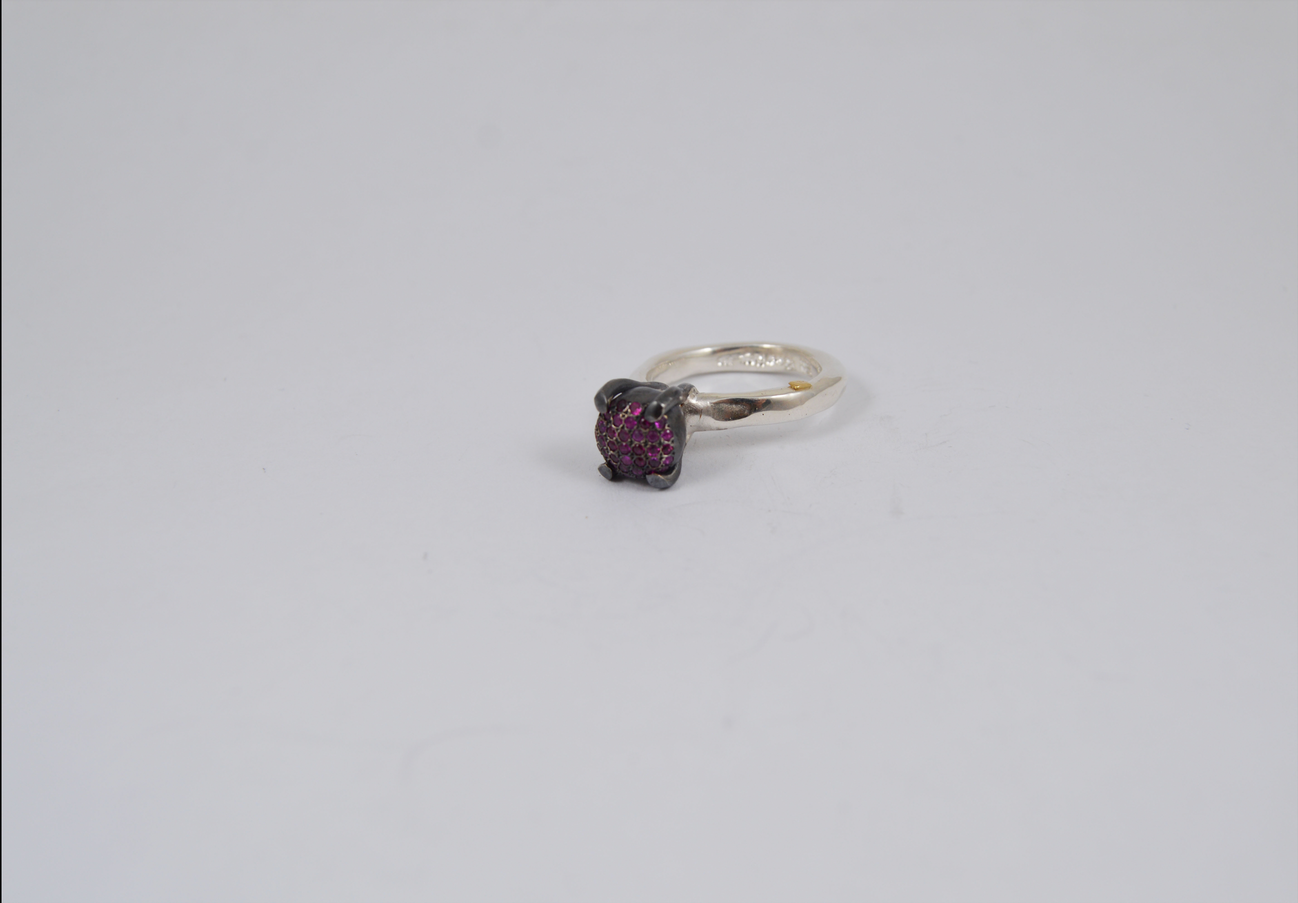 Rosa Maria Yoko Rubies & Silver Ring featuring a close-up of textured sterling silver band with raw ruby accents.