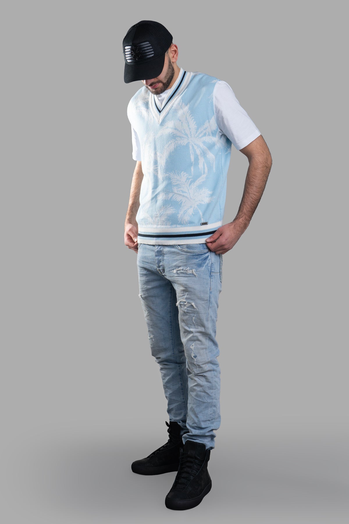 Gaëlle Paris Knit Vest, front view on-model, features V-neck, sleeveless design, blue palm print, 100% cotton.