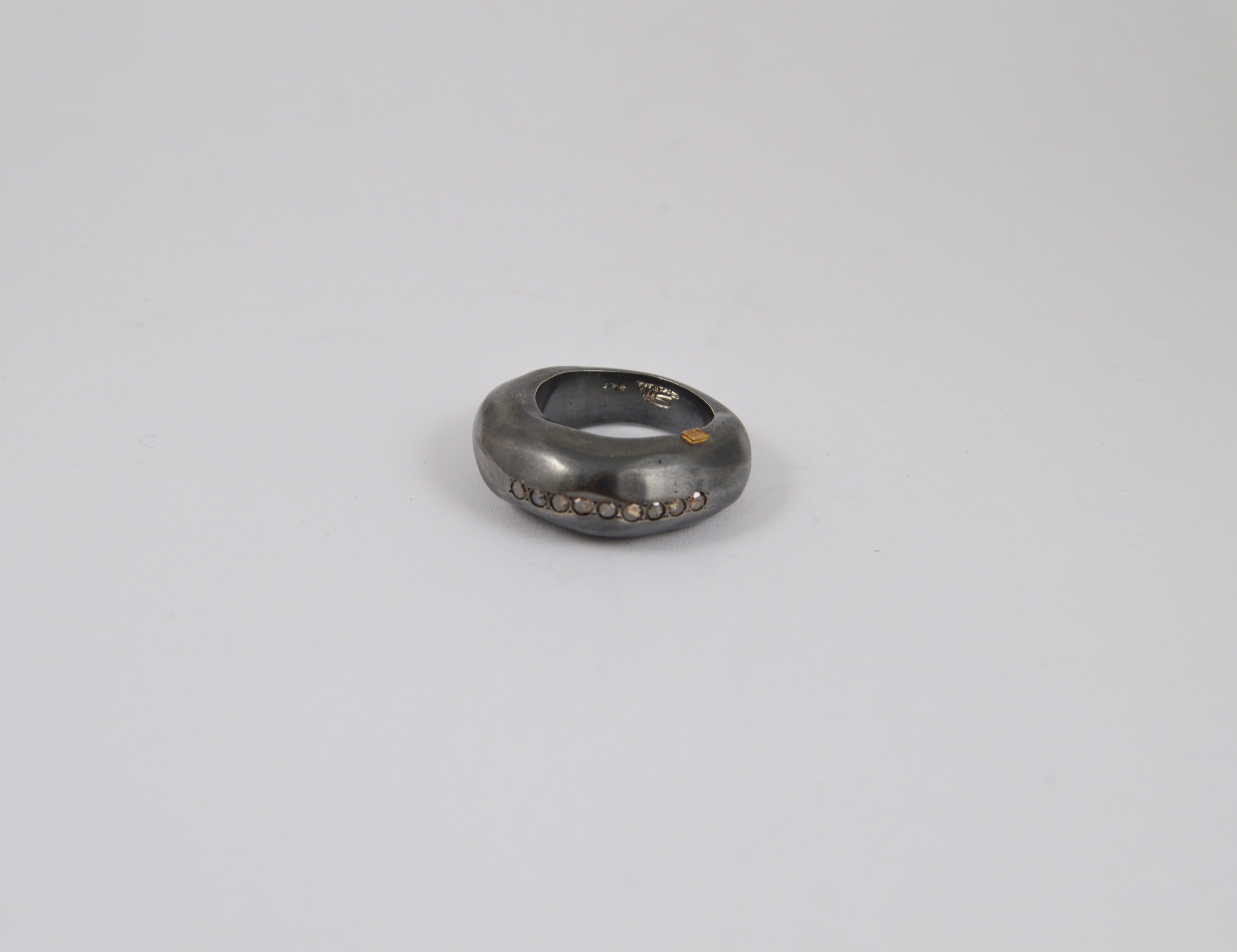 Rosa Maria Tiger Ring in silver with cognac diamonds, showcasing a raw, organic shape. Side view highlighting texture.