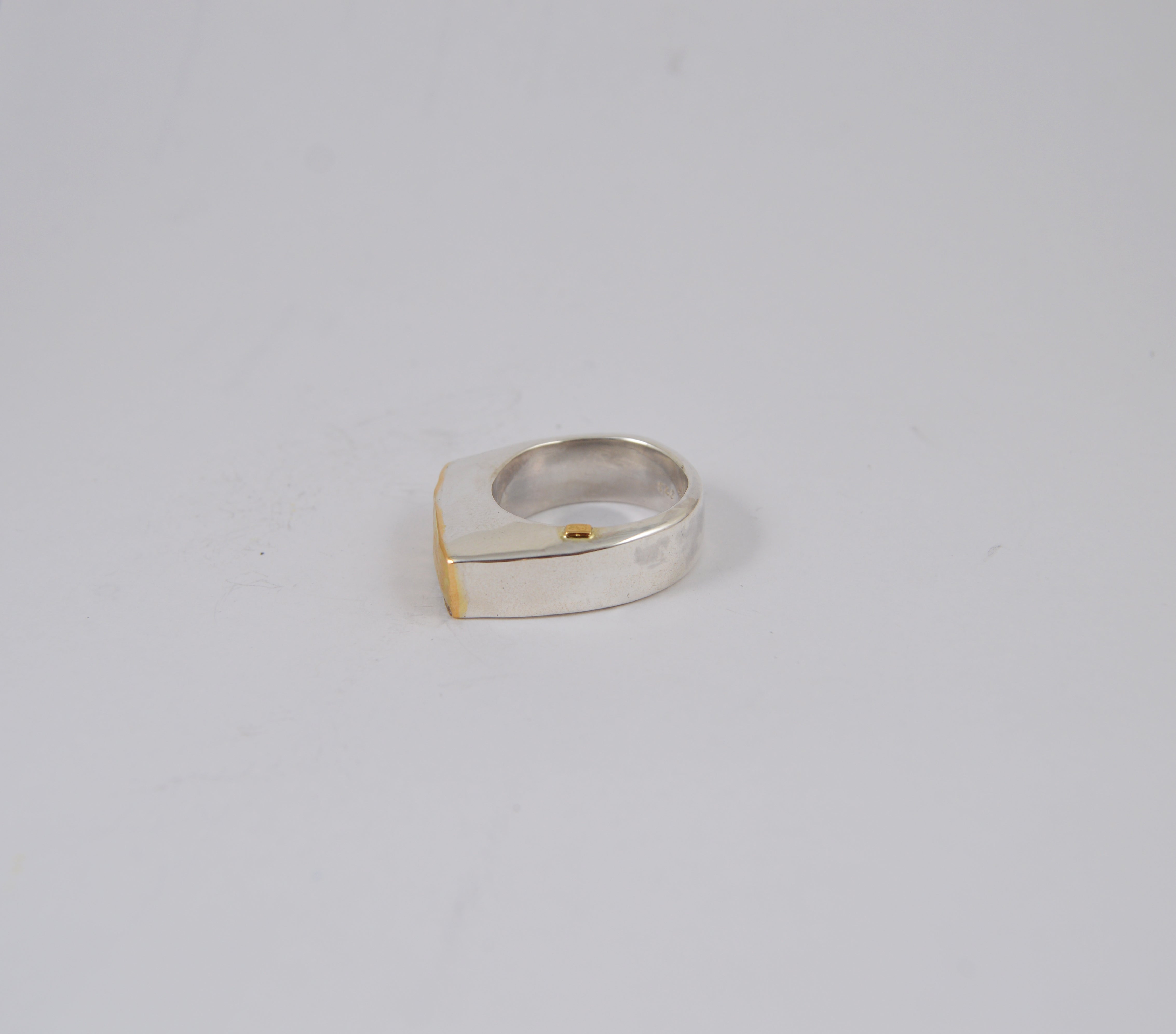 Rosa Maria Tumi Ring in sterling silver with 18k yellow gold accent, showcasing unique raw organic design details.